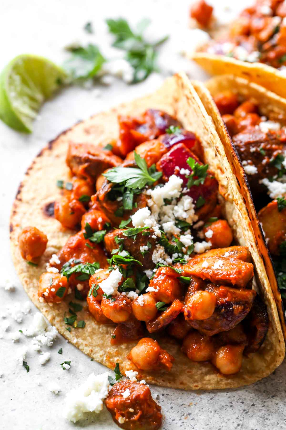 One chickpea taco showing filling and fresh garnishes