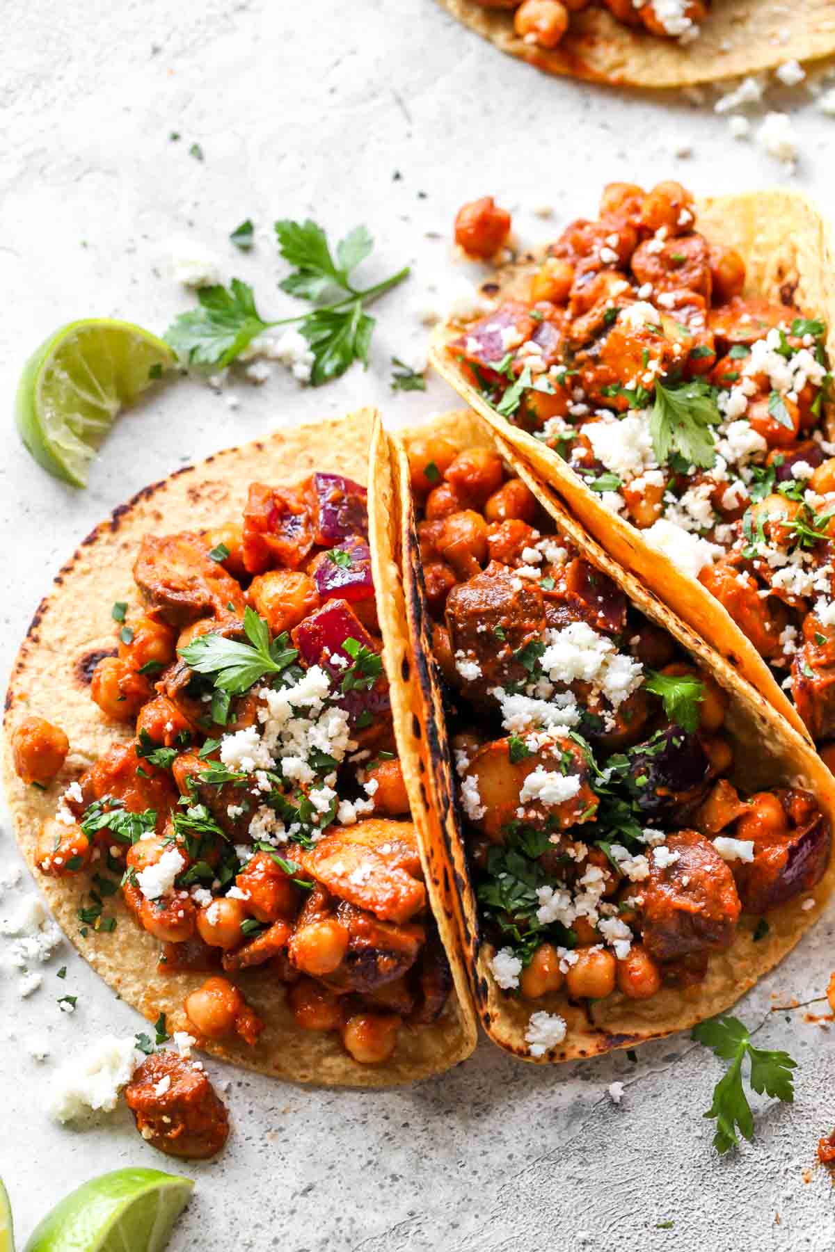 Chickpea and mushroom tacos topped with queso fresco and cilantro