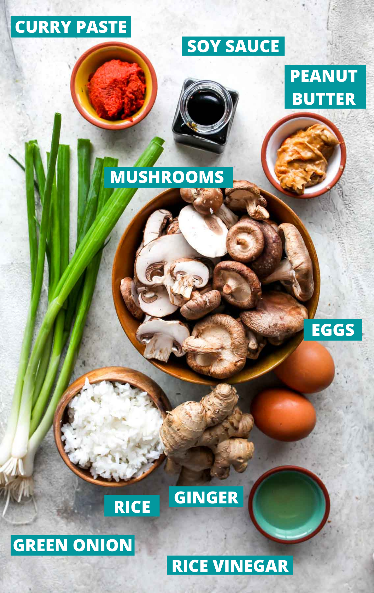 Mushroom fried rice ingredients in separate bowls with blue labels