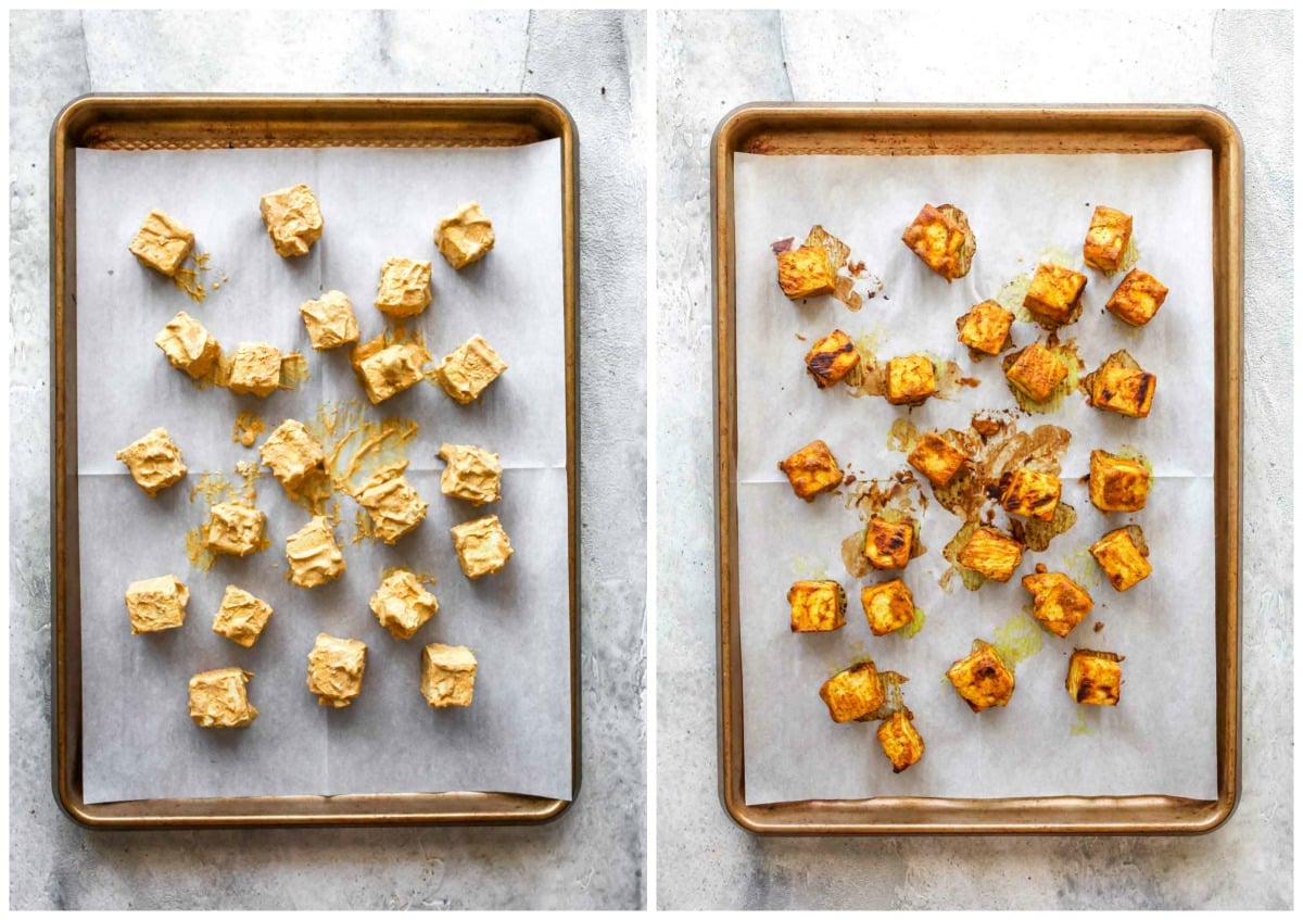Cubes of marinated tofu being baked on a rimmed baking sheet