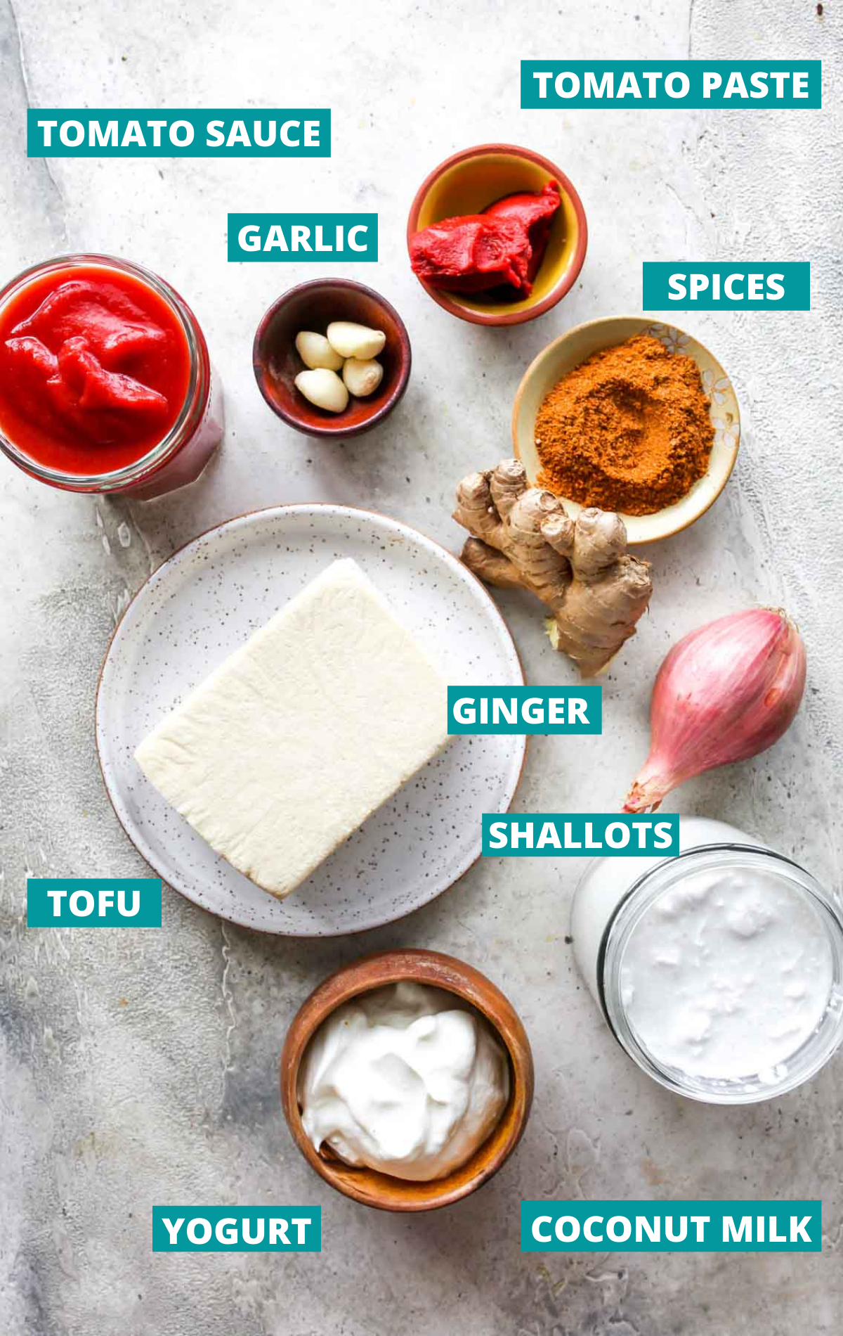 Tofu tikka masala ingredients in separate bowls with blue labels