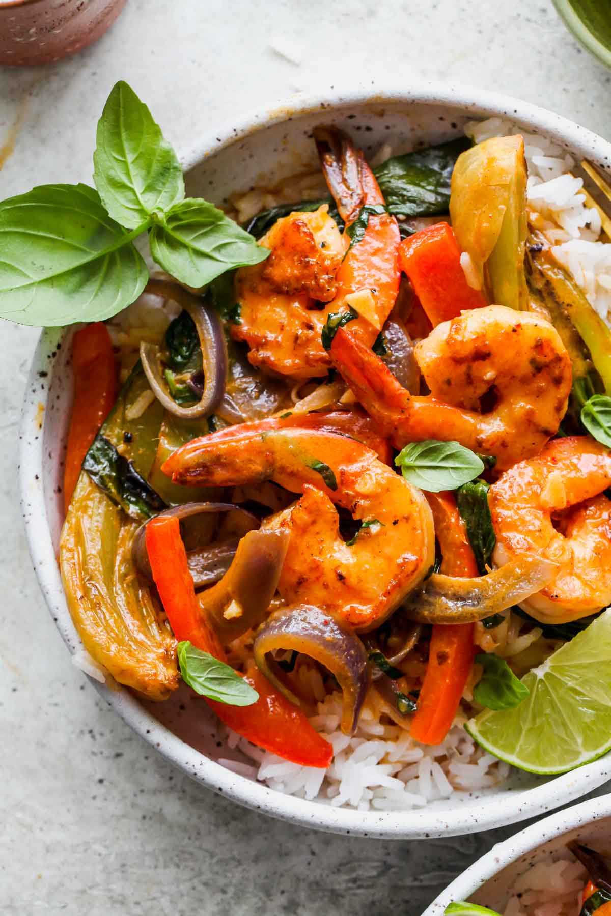 Pan-seared shrimp, peppers, and bok choy tossed in curry sauce and served over rice