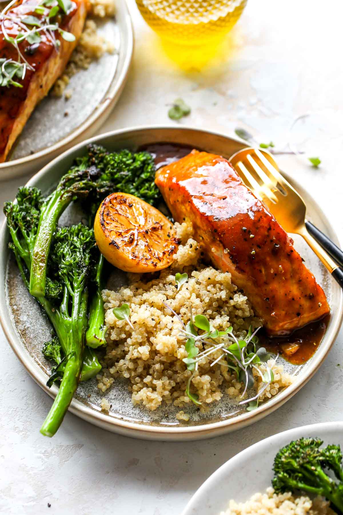 Maple-glazed salmon served with quinoa and broccoli on a plate
