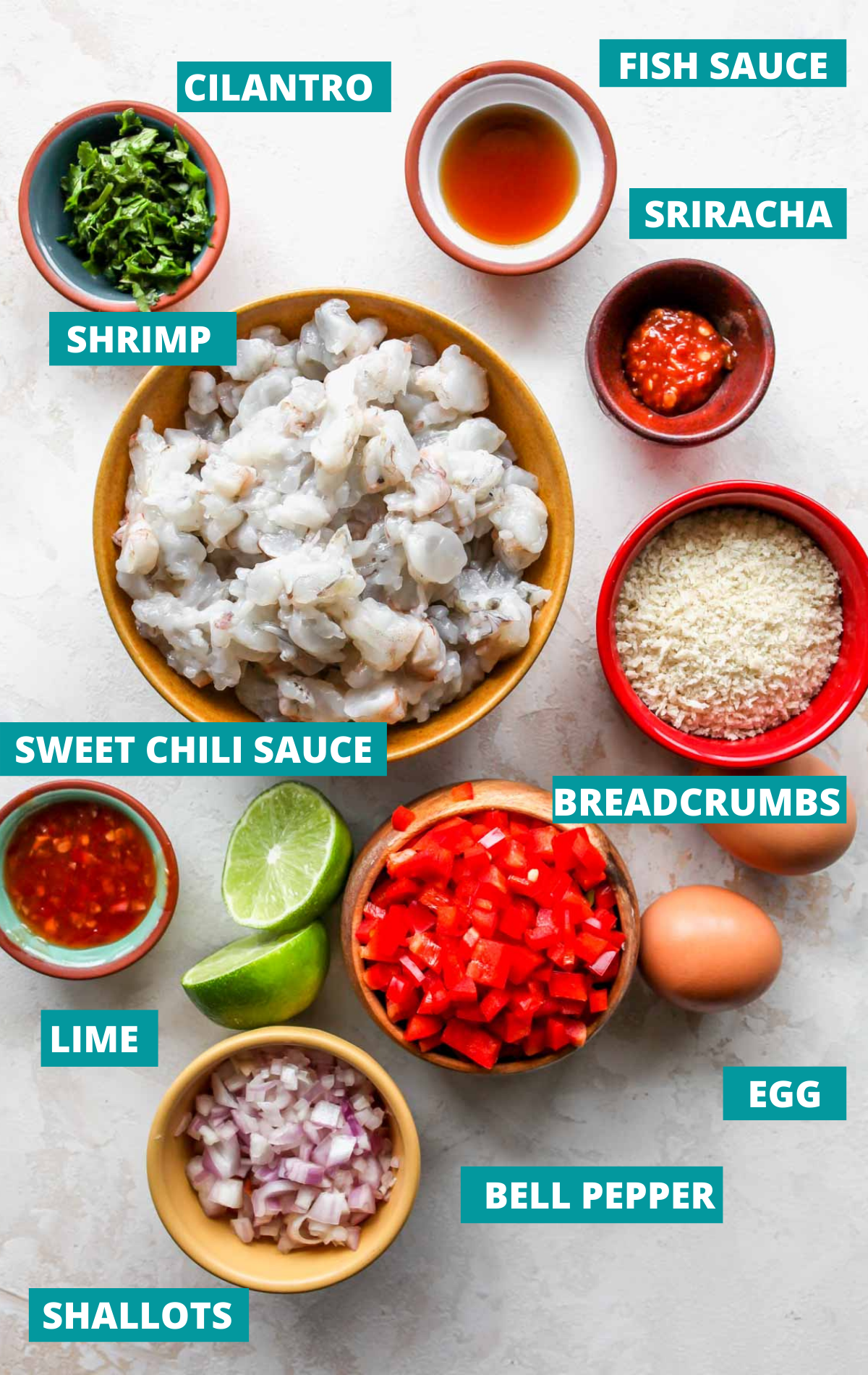Recipe ingredients in separate bowls with blue labels