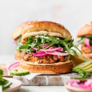 Wild Rice Burgers with Tahini Special Sauce, pickled red onion, and avocado