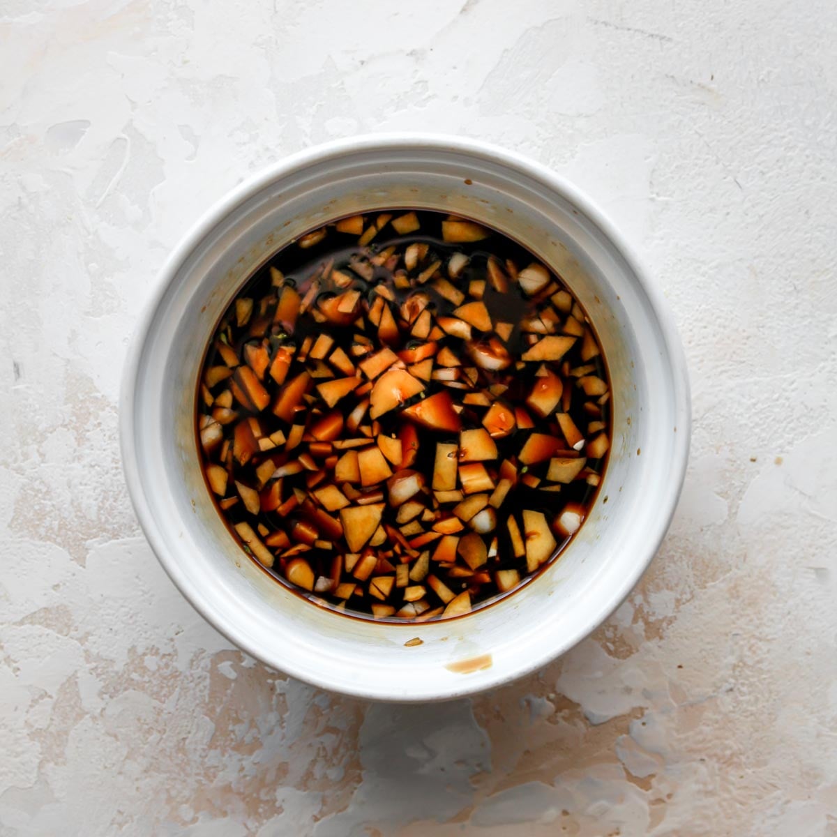 Soy sauce, garlic, and sugar mixed in a bowl