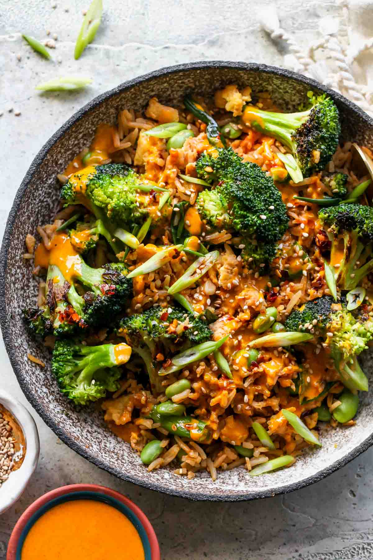 Broccoli, fried, rice, and sesame seeds in a bowl