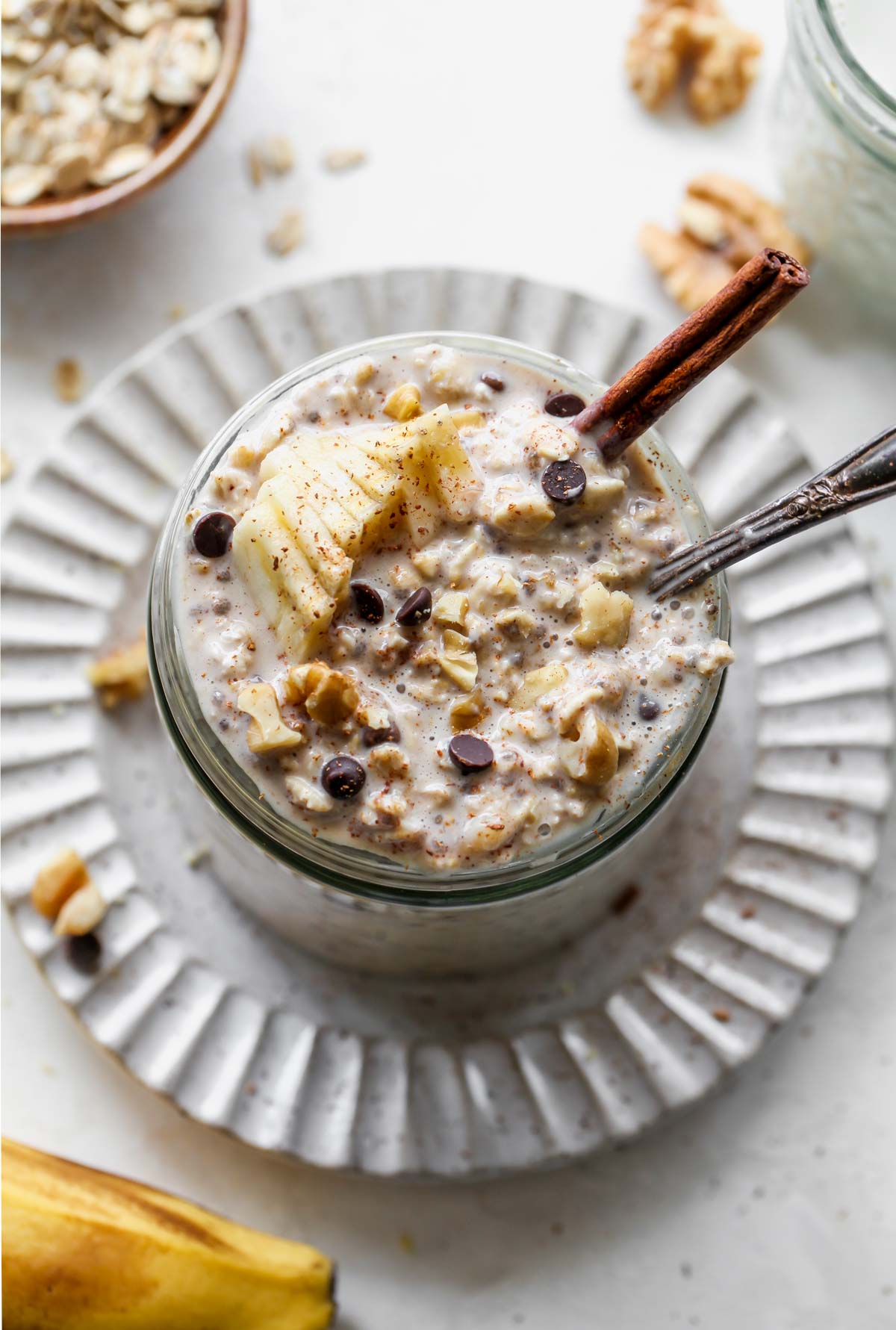 Overnight oats in a jar topped with banana slices and cinnmon
