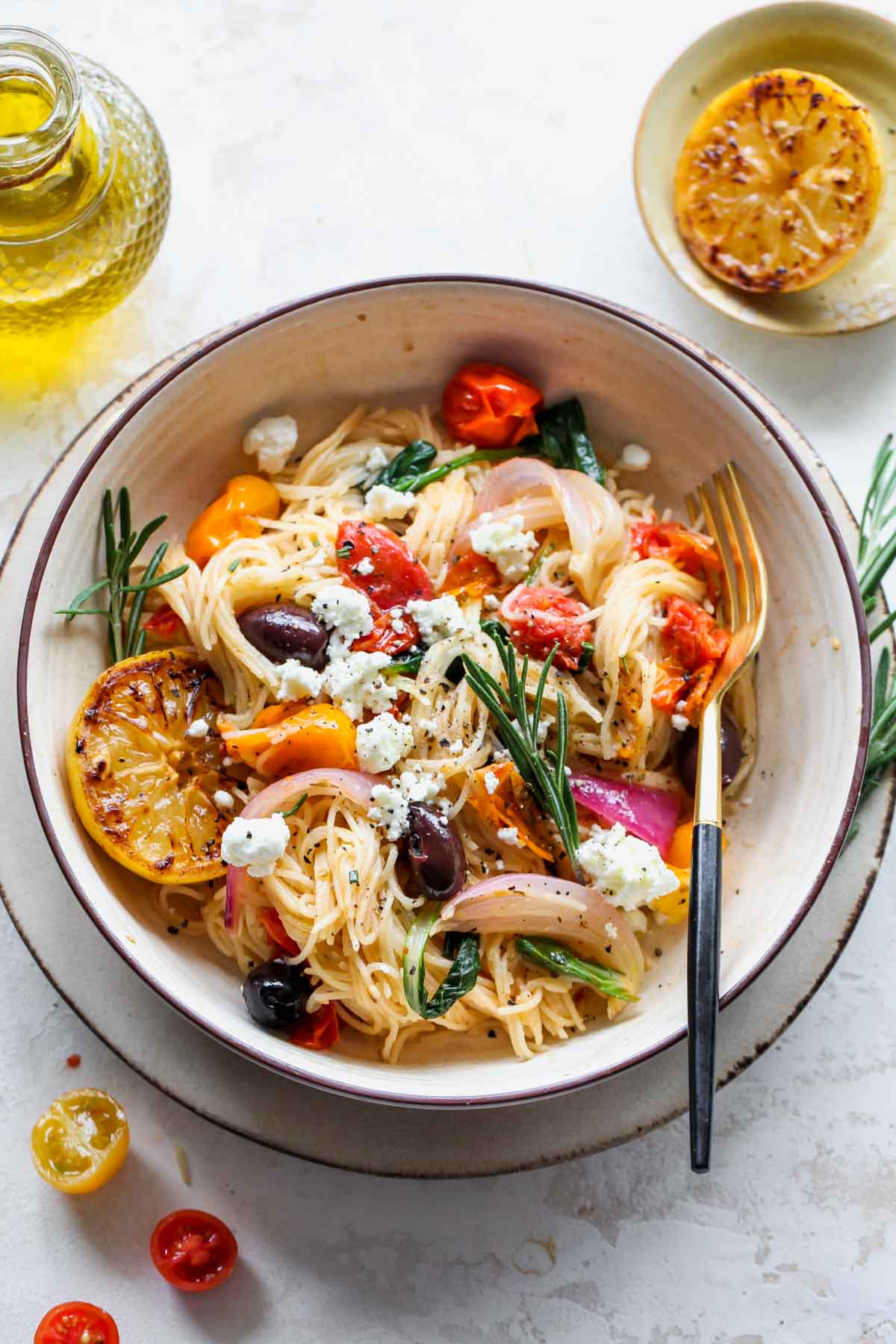 Mediterranean Pasta being twirled with a fork in a large serving bowl