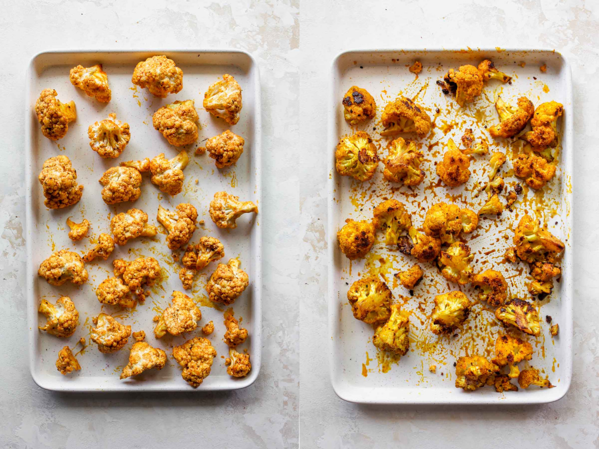 Cauliflower florets being roasted on a white baking sheet