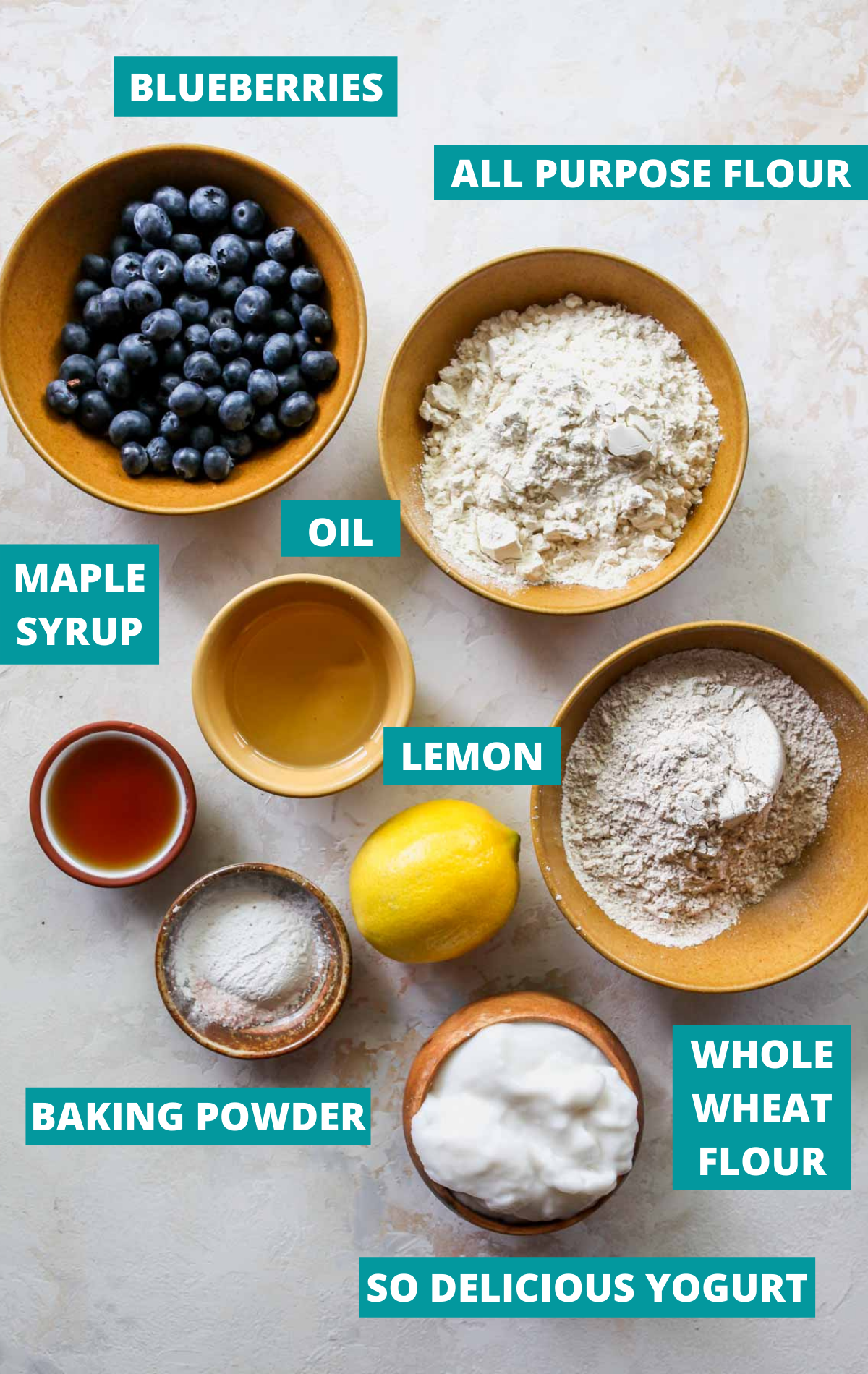 Recipe ingredients laid out in separate bowls with blue labels