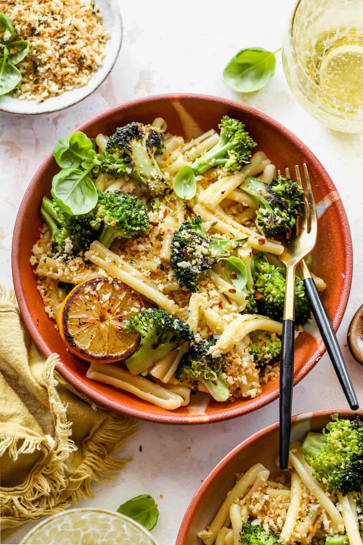 Broccoli pasta in a bowl topped with panko breadcrumbs
