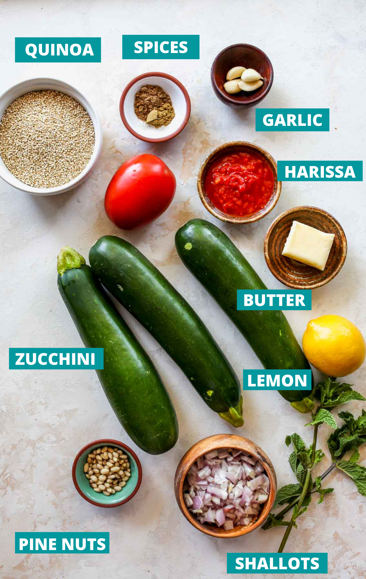Stuffed zucchini ingredients in separate bowls with blue labels