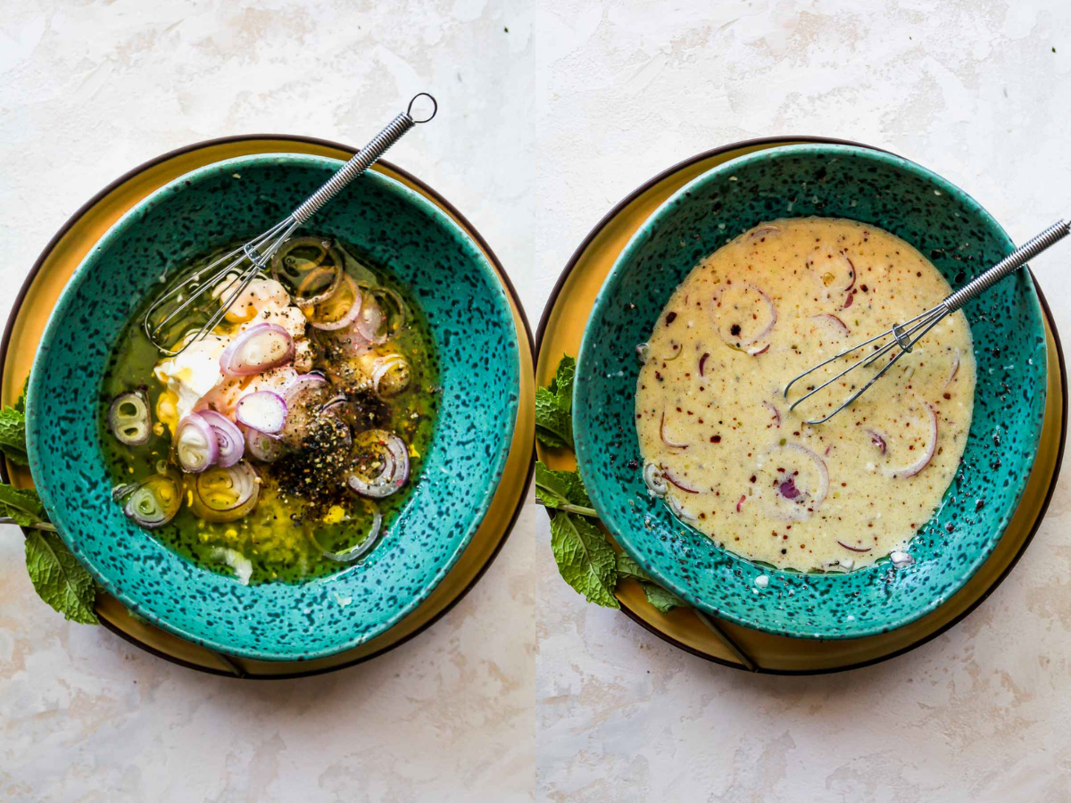 Olive oil, mayonnaise, vinegar, and shallots being whisked together in a blue bowl