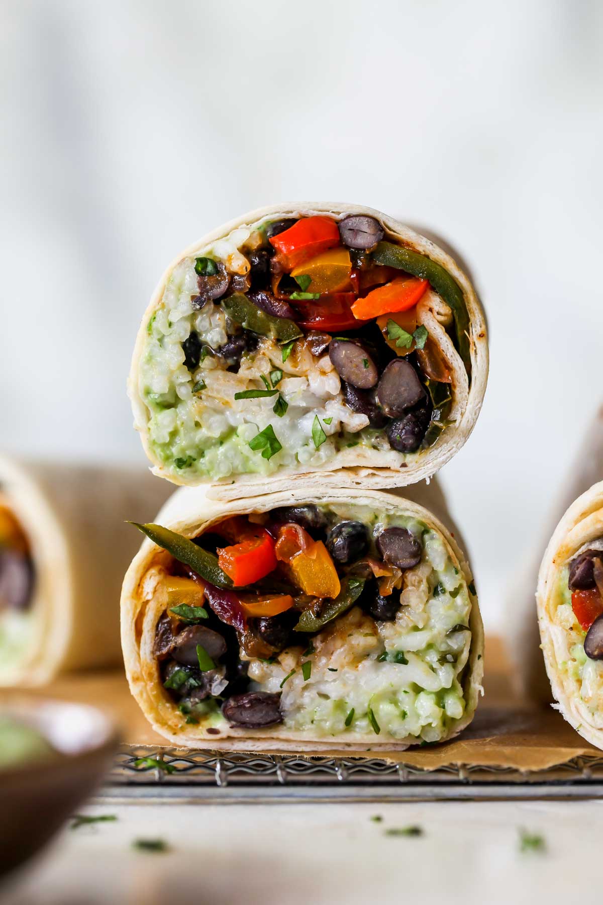 A stacked burrito on a serving platter