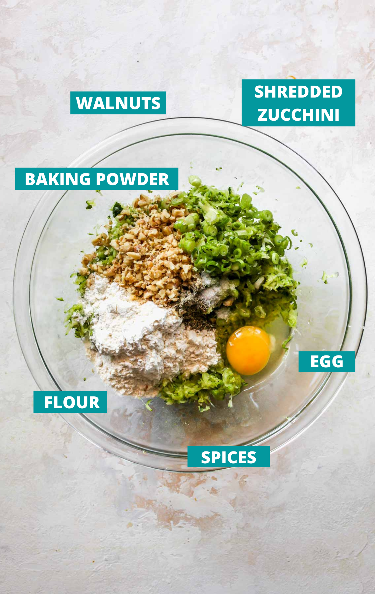 Fritter ingredients displayed in a bowl with blue labels