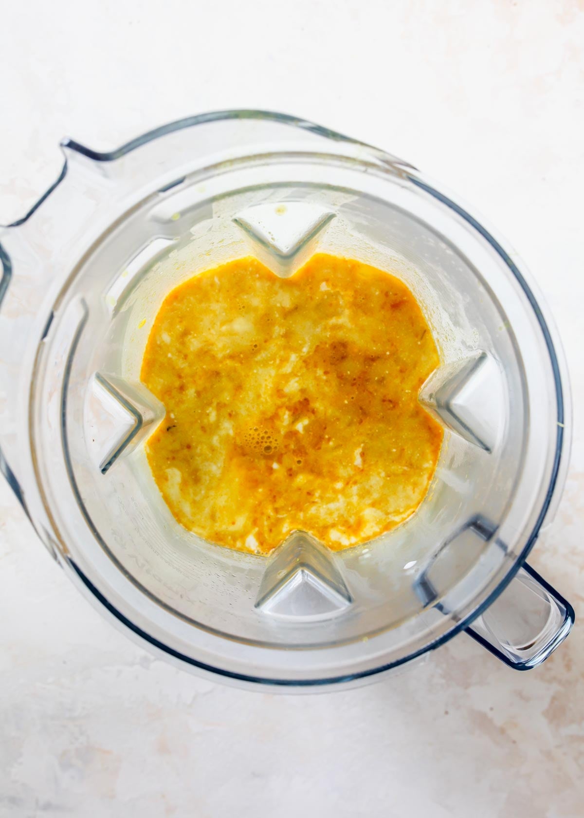 Half of chowder being added to a blender