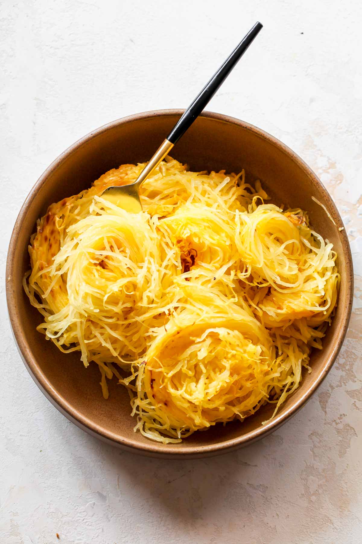 Strands of spaghetti squash assembled in a bowl