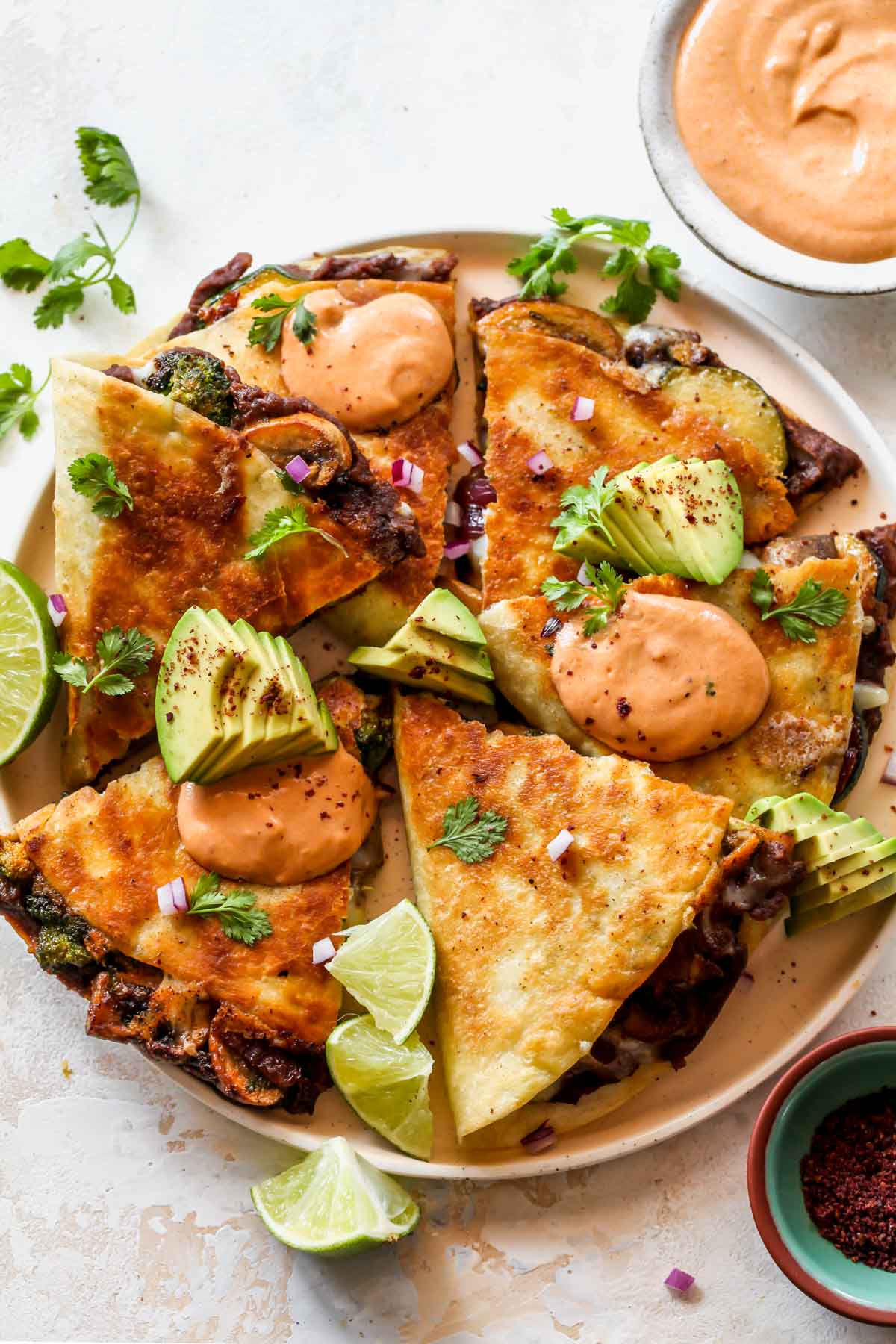 A plate of quesadillas sliced into thirds