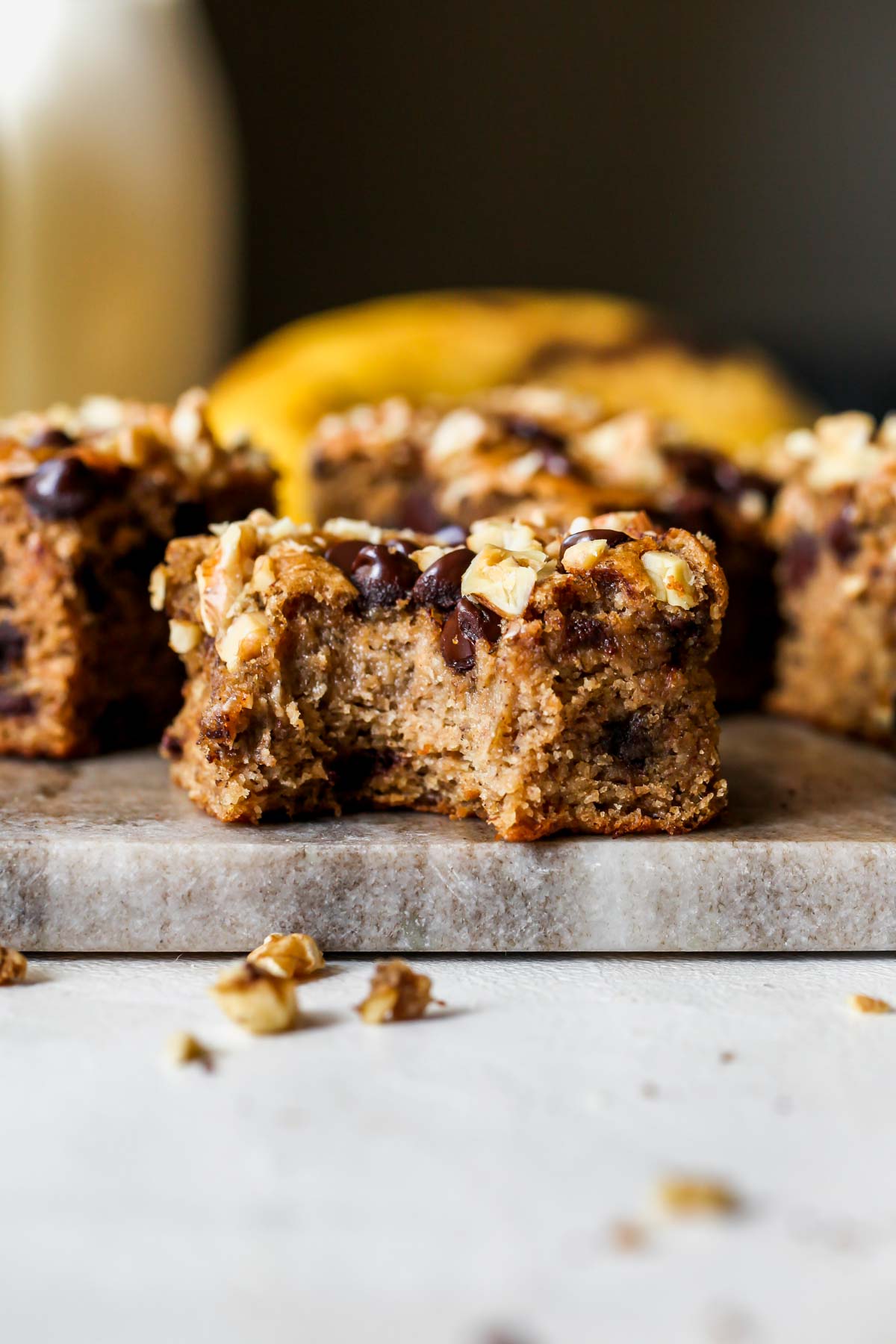 One banana bread bar with a bite taken out to show insides