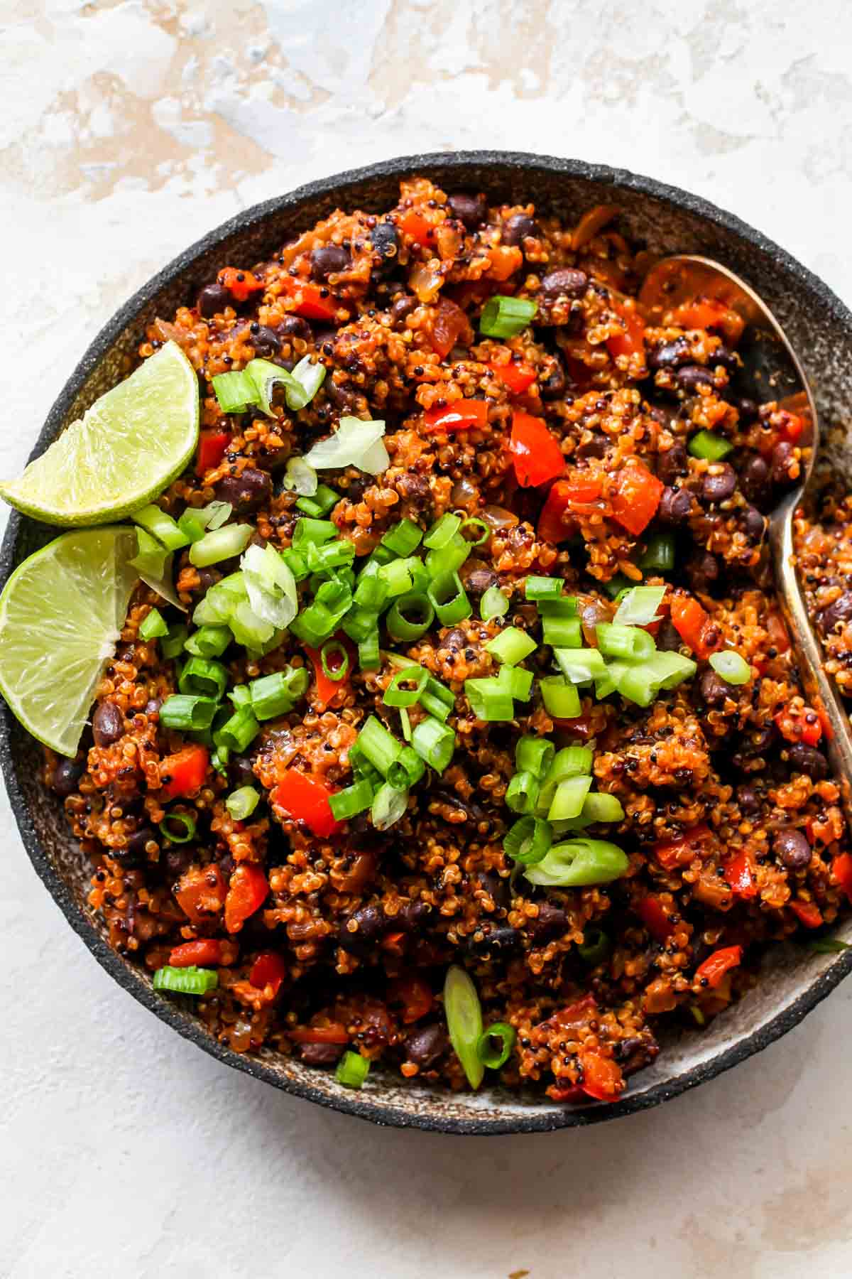 A silver bowl filled with taco-spiced quinoa taco filling