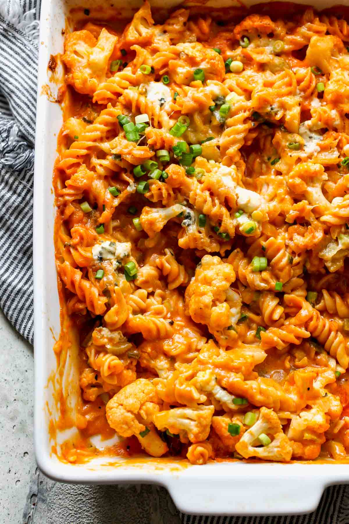 Buffalo cauliflower mac and cheese in a white pan