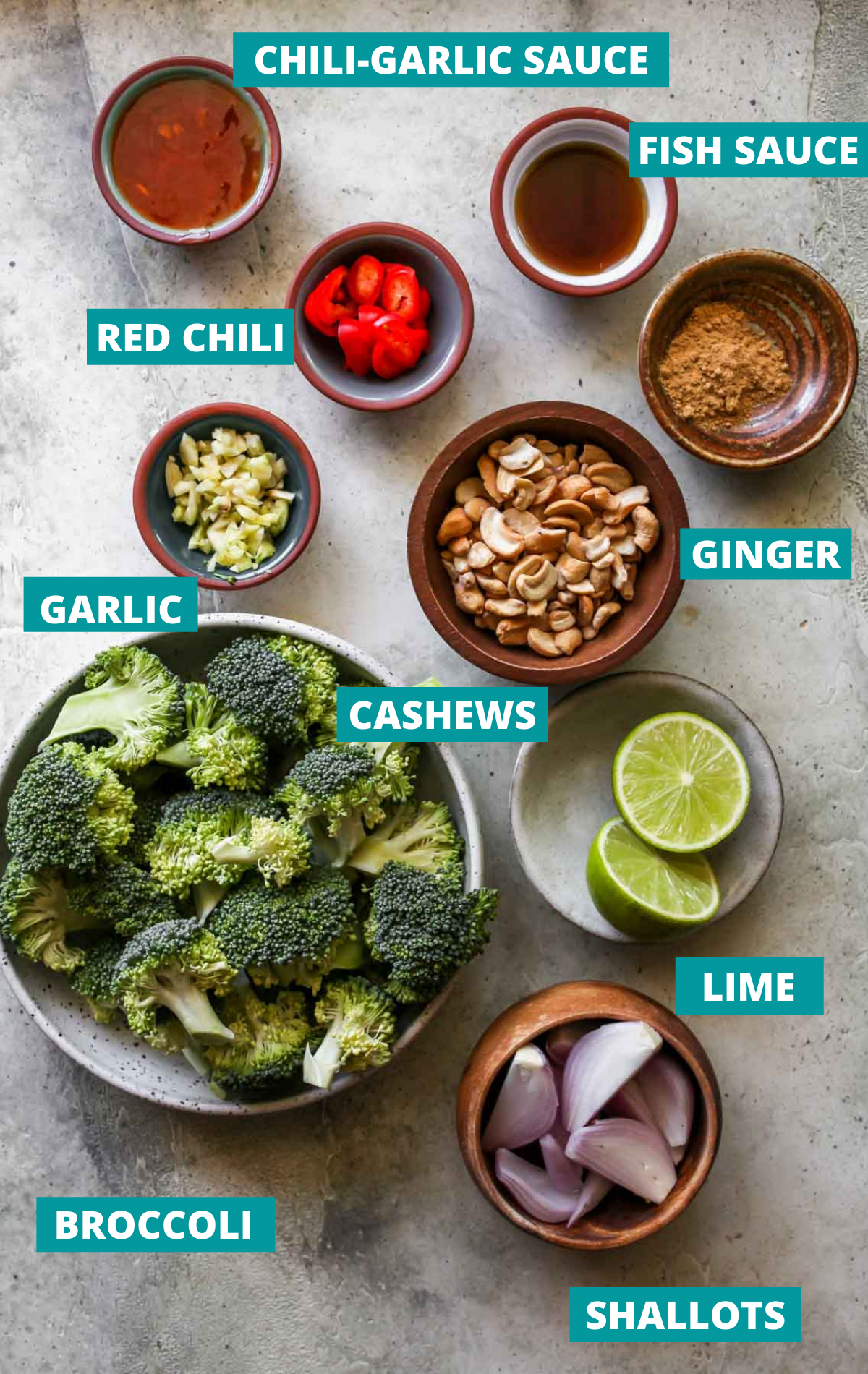 Recipe ingredients on a cement board with blue labels.