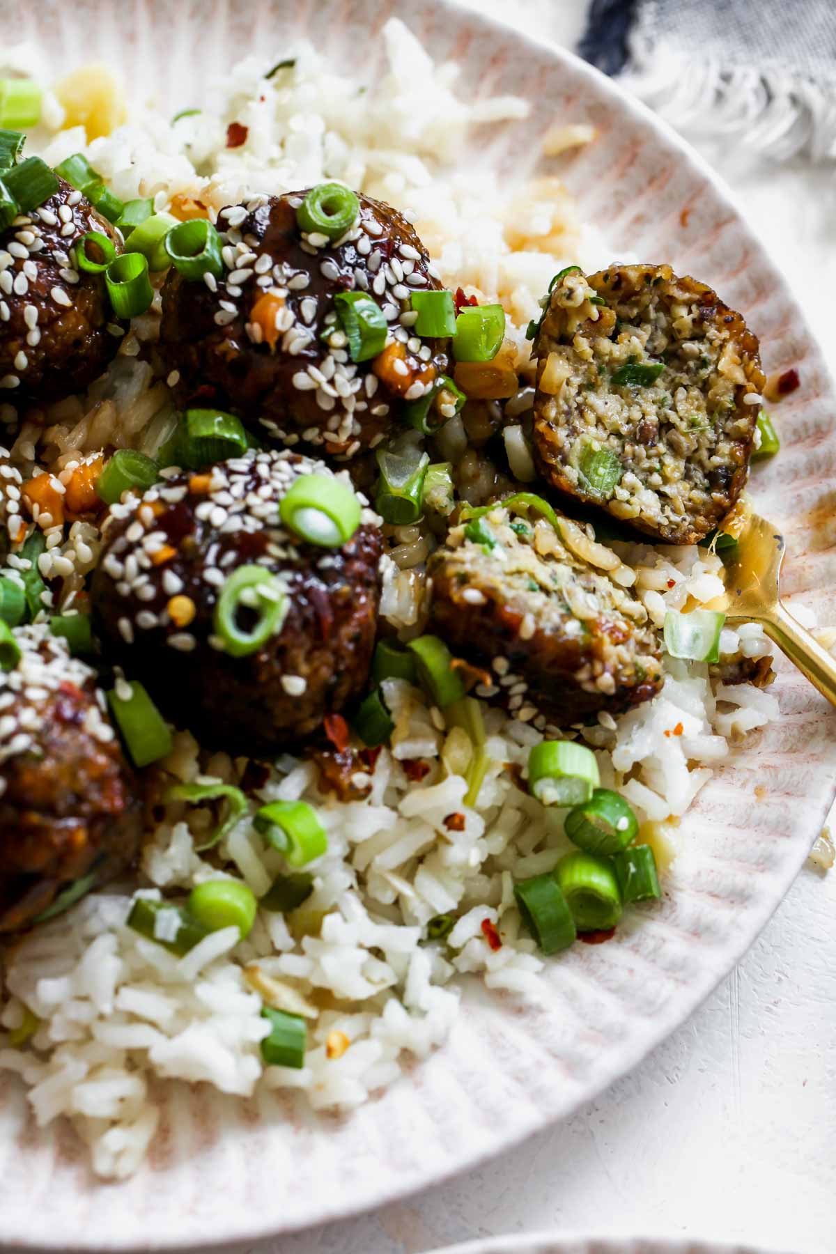 A mushroom meatball being sliced into to see inside texture