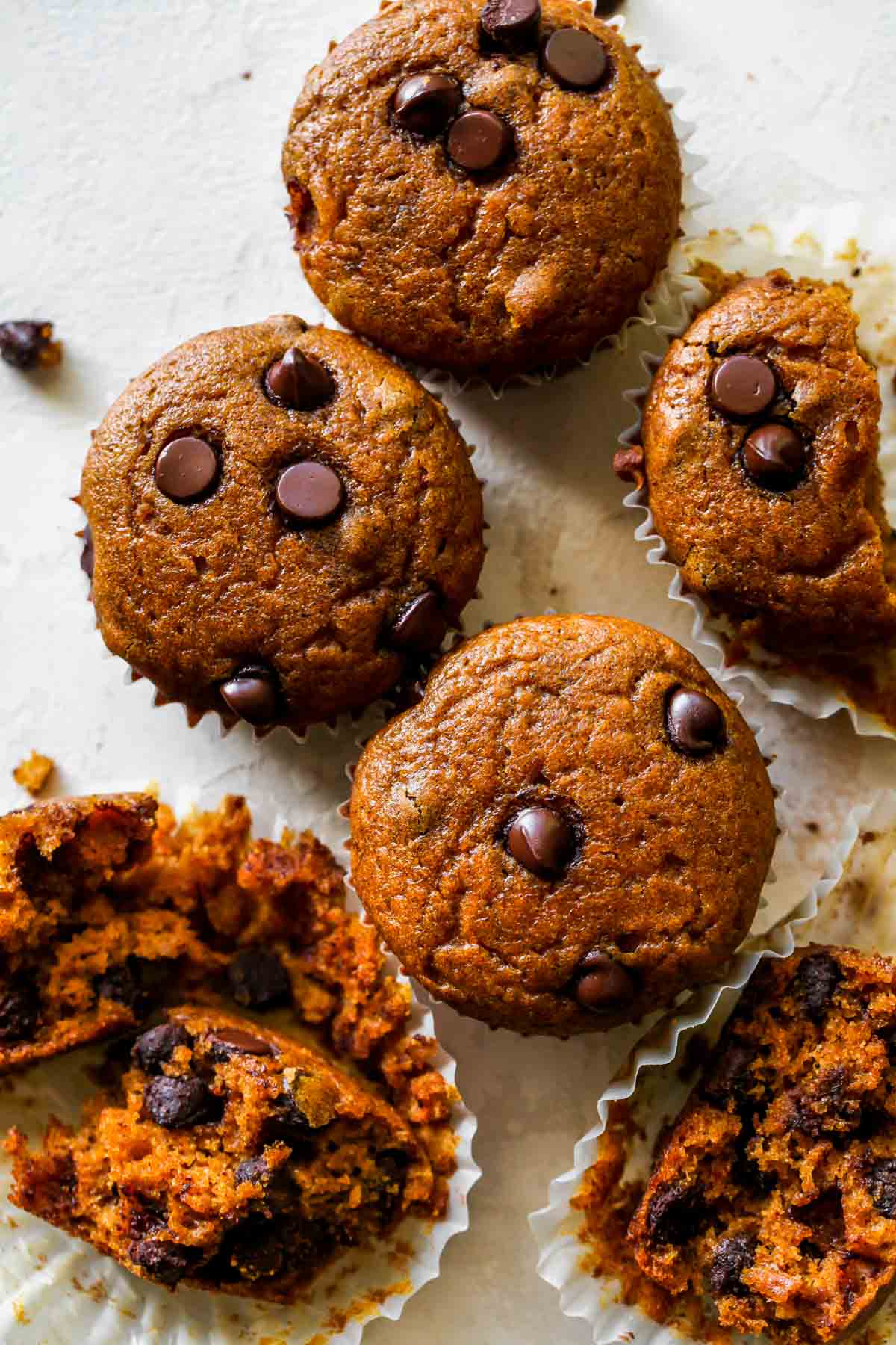 Pumpkin muffins cut into on a white board