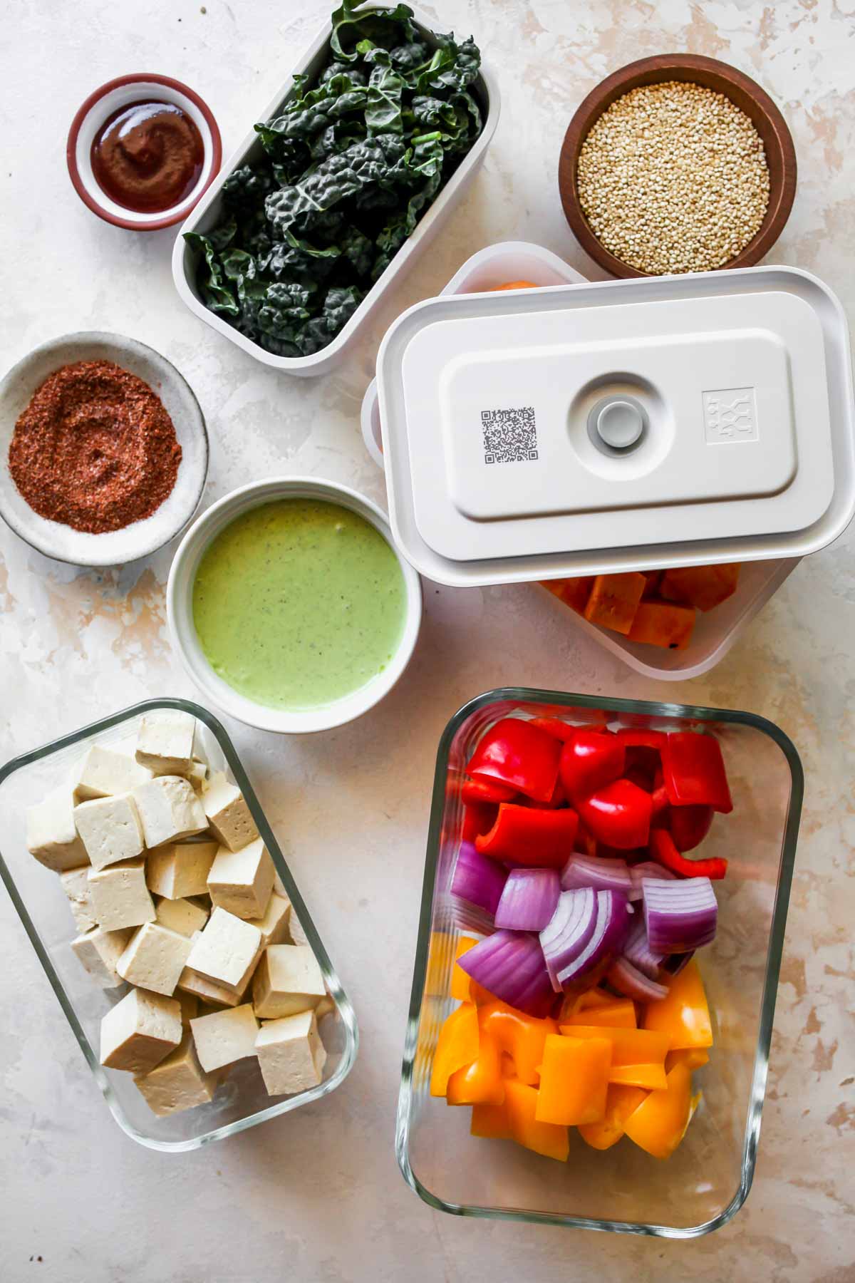 Recipe ingredients in separate containers on a white board