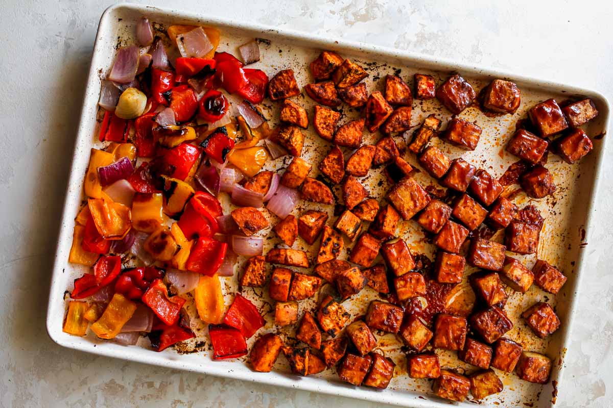 BBQ tofu on a sheet pan with roasted sweet potatoes and vegetables