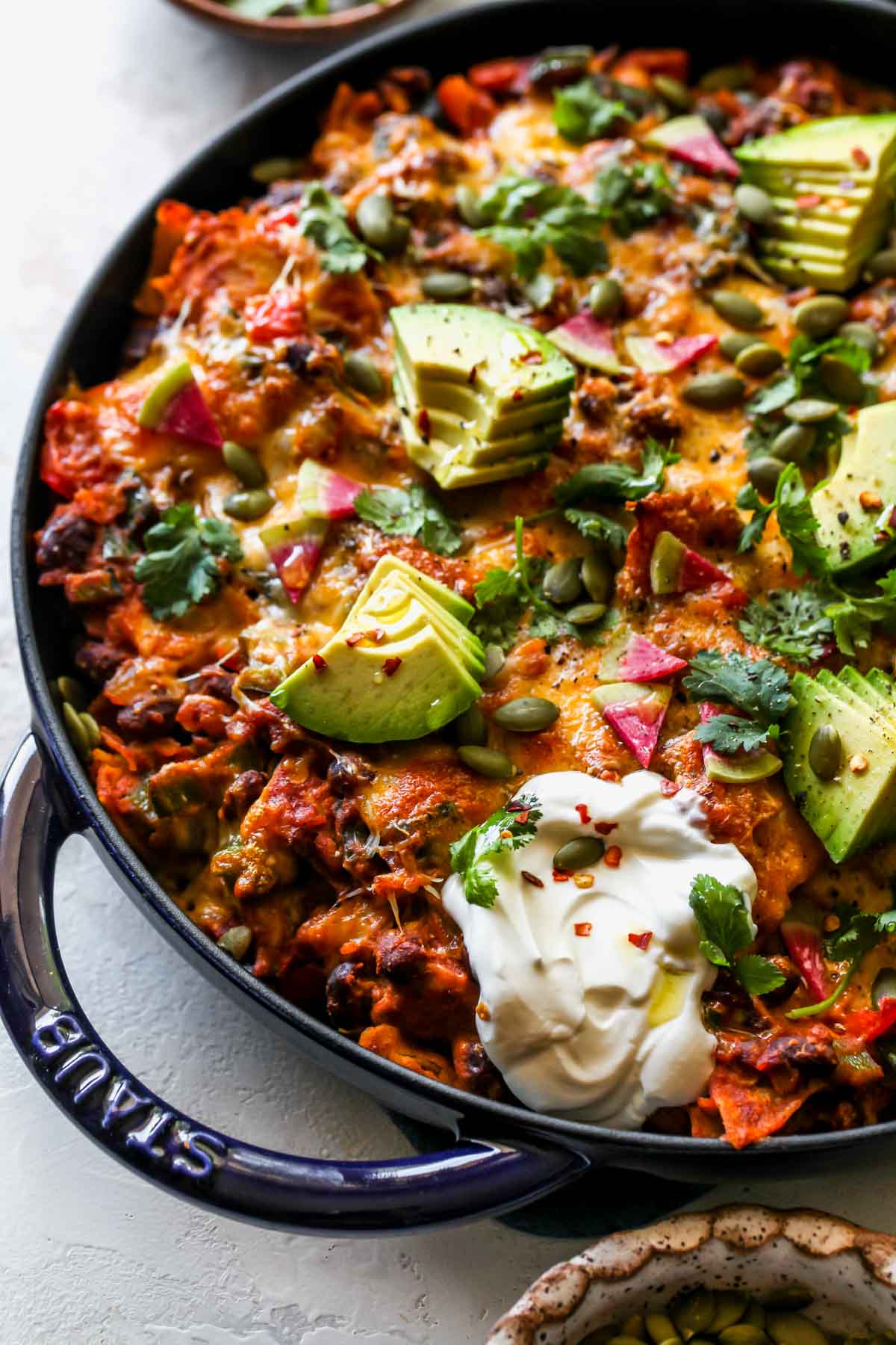 Pumpkin Enchiladas after being baked and topped with garnishes