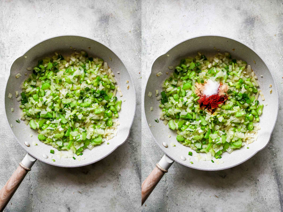 Onion, celery, and scallions being sautéed in a white skillet