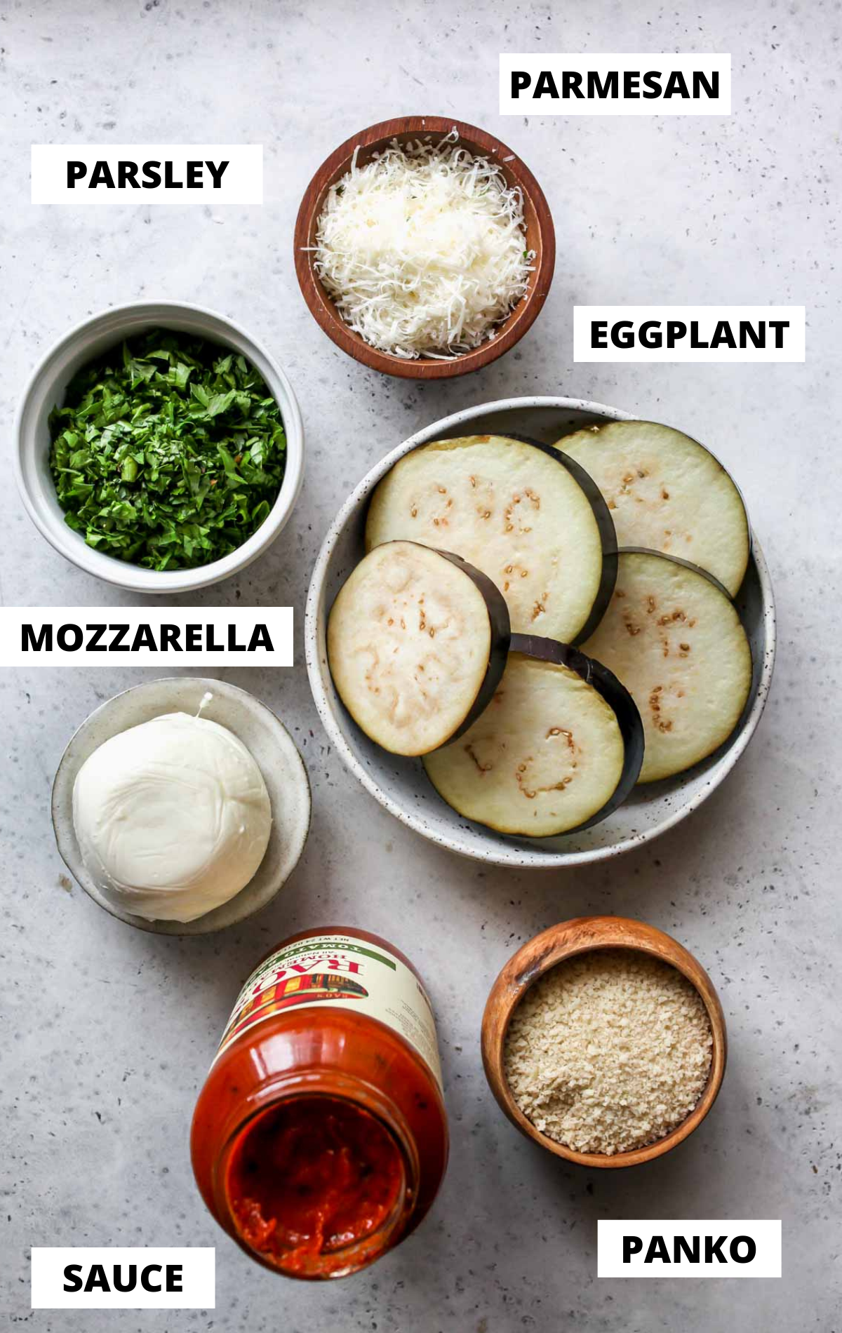 Recipe ingredients on separate bowls shown on a board with labels