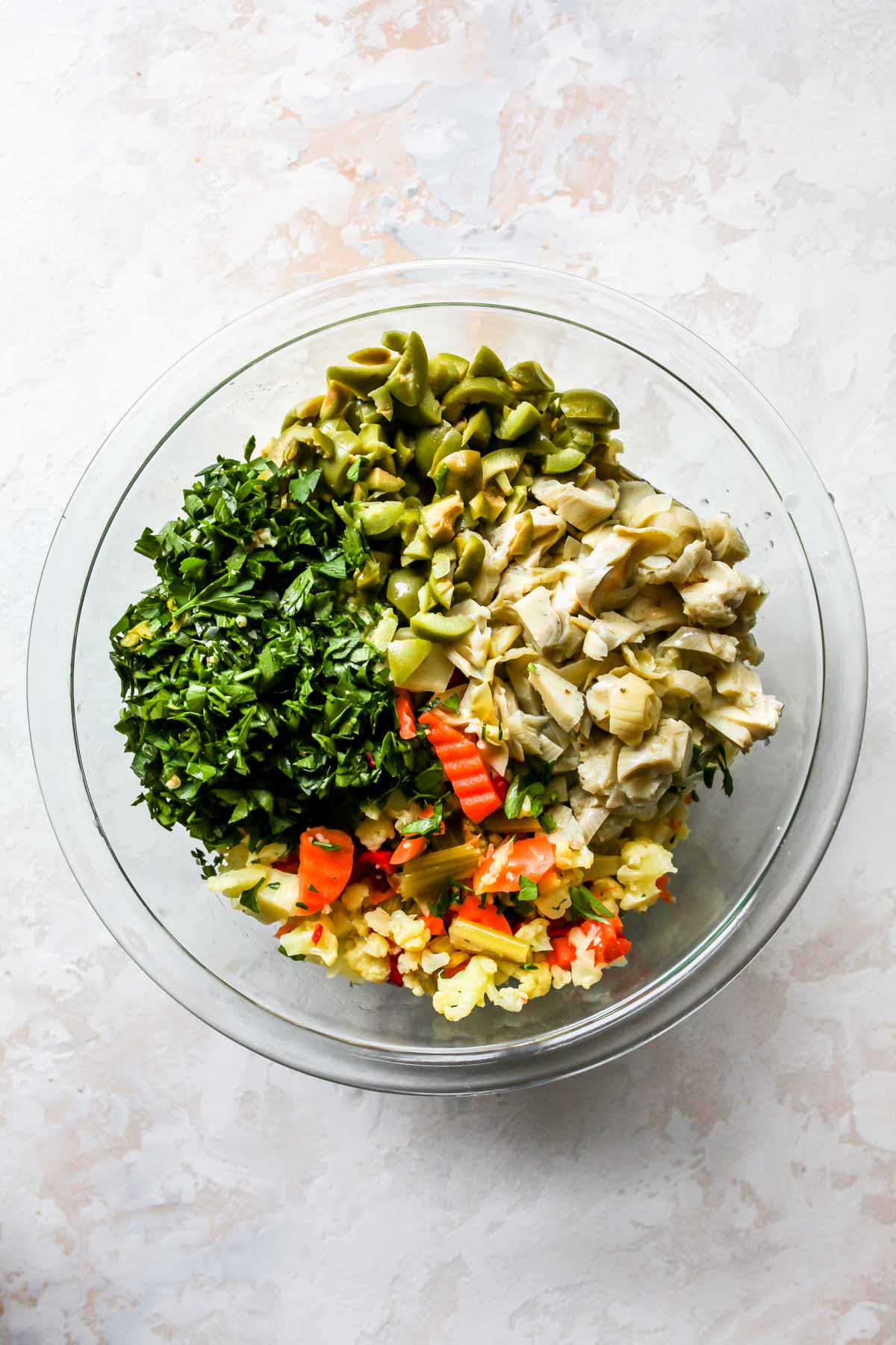 Artichokes, olives, parsley, and Giardiniera in a bowl