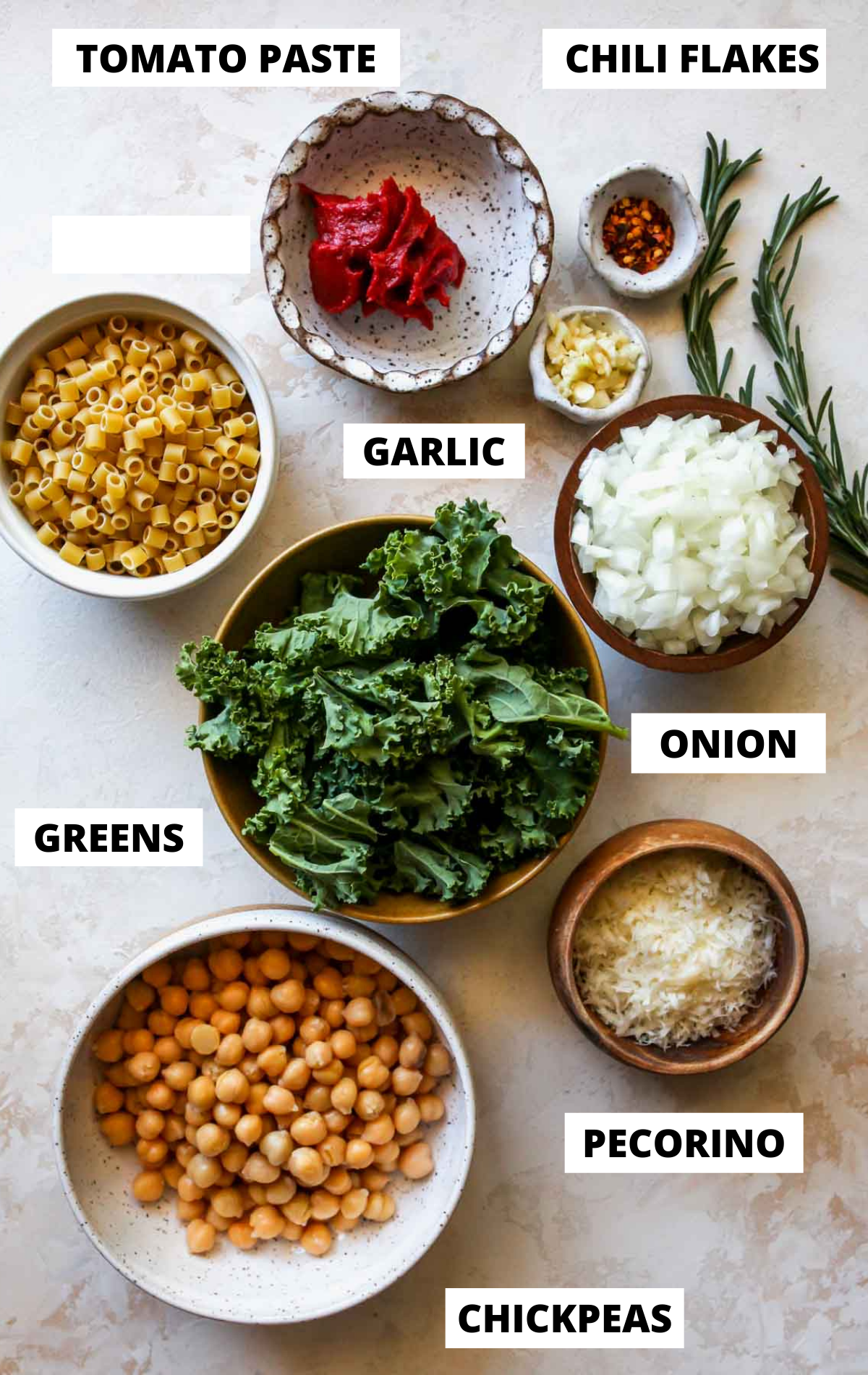 Recipe ingredients in separate bowls on white board with labels.
