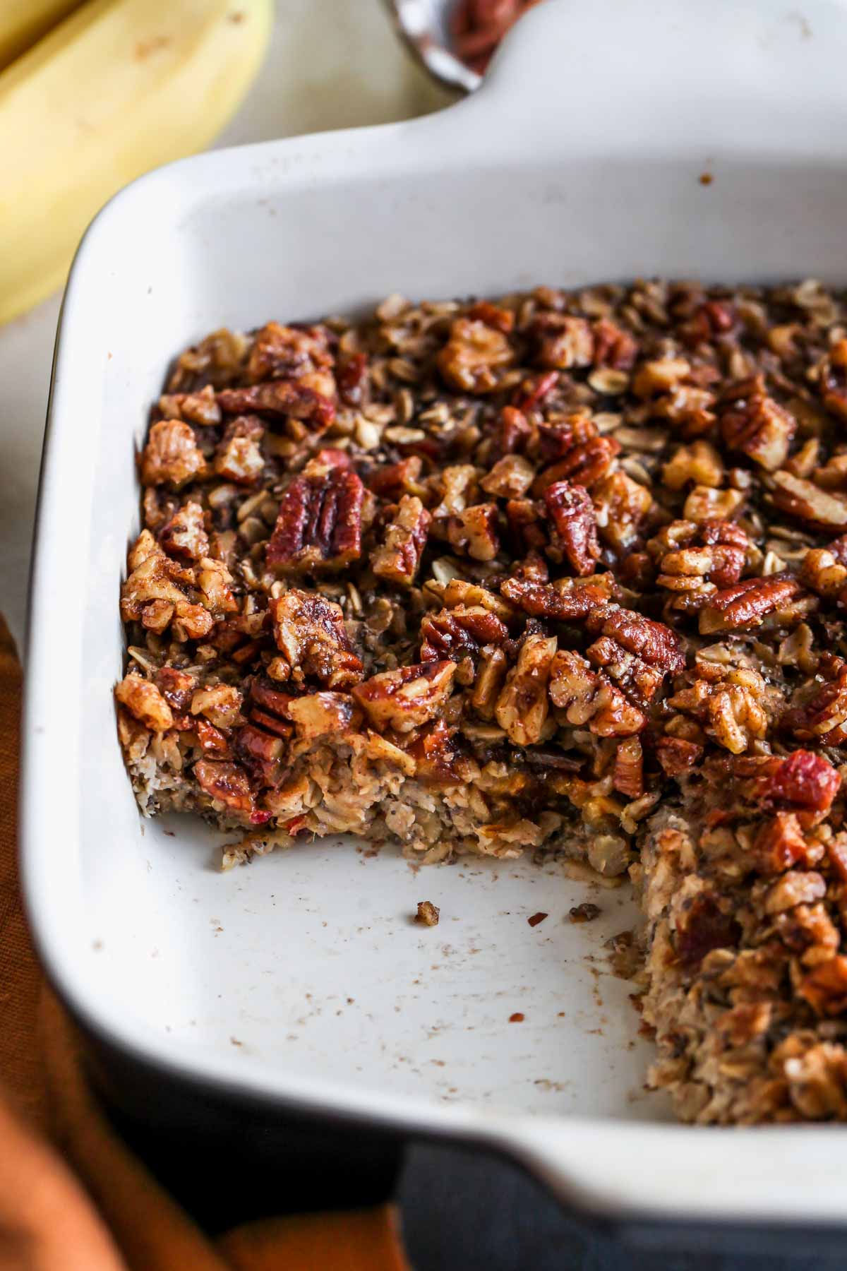Pan of baked oatmeal with a slice removed to see center