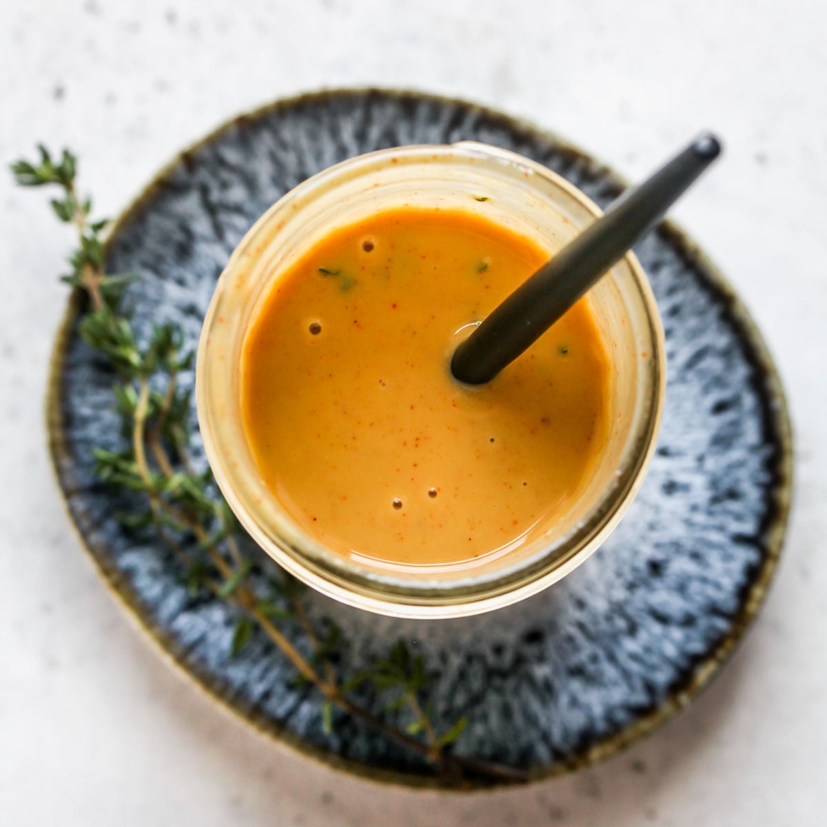 Maple mustard salad dressing in a glass jar