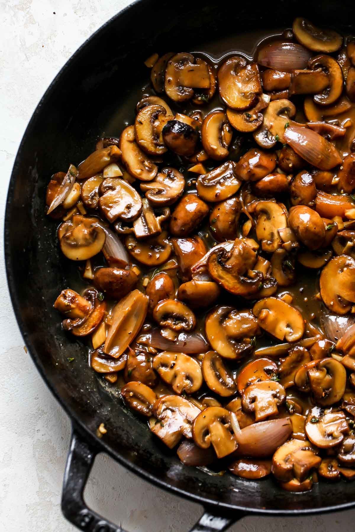 Skillet of baby bellas in creamy marsala sauce