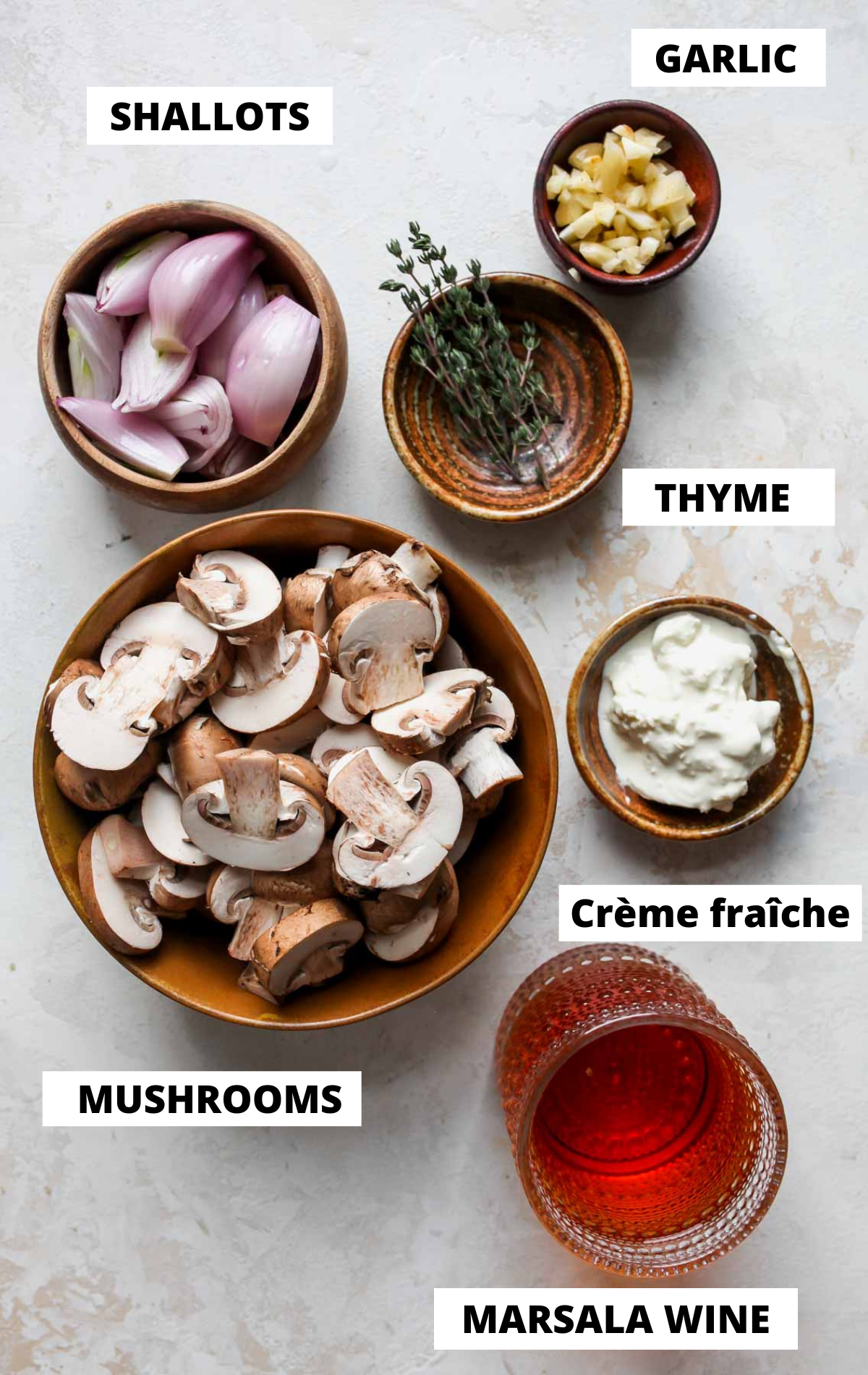 Recipe ingredients on separate bowls shown on a board with labels