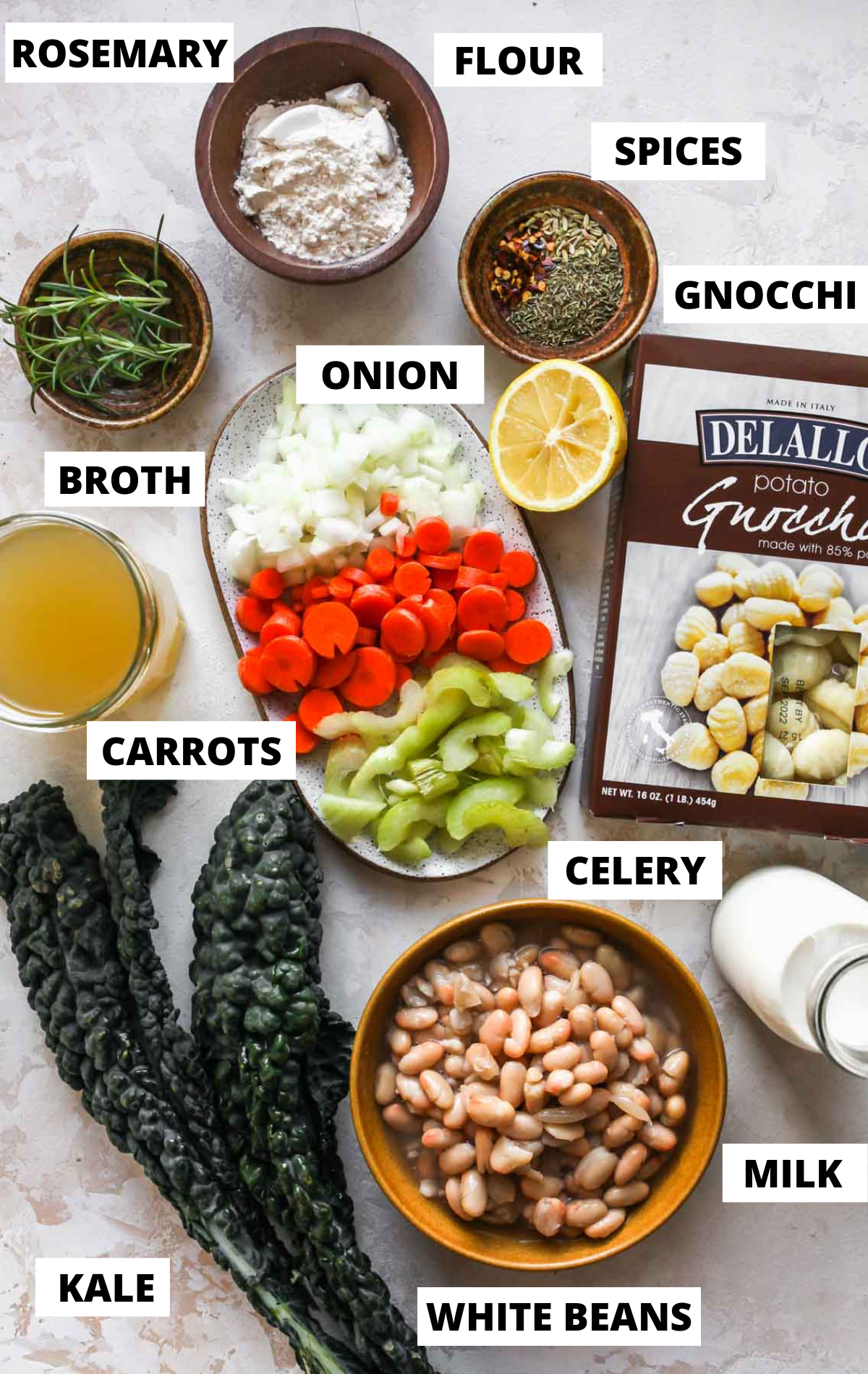 Recipe ingredients in separate bowls on a white board with labels