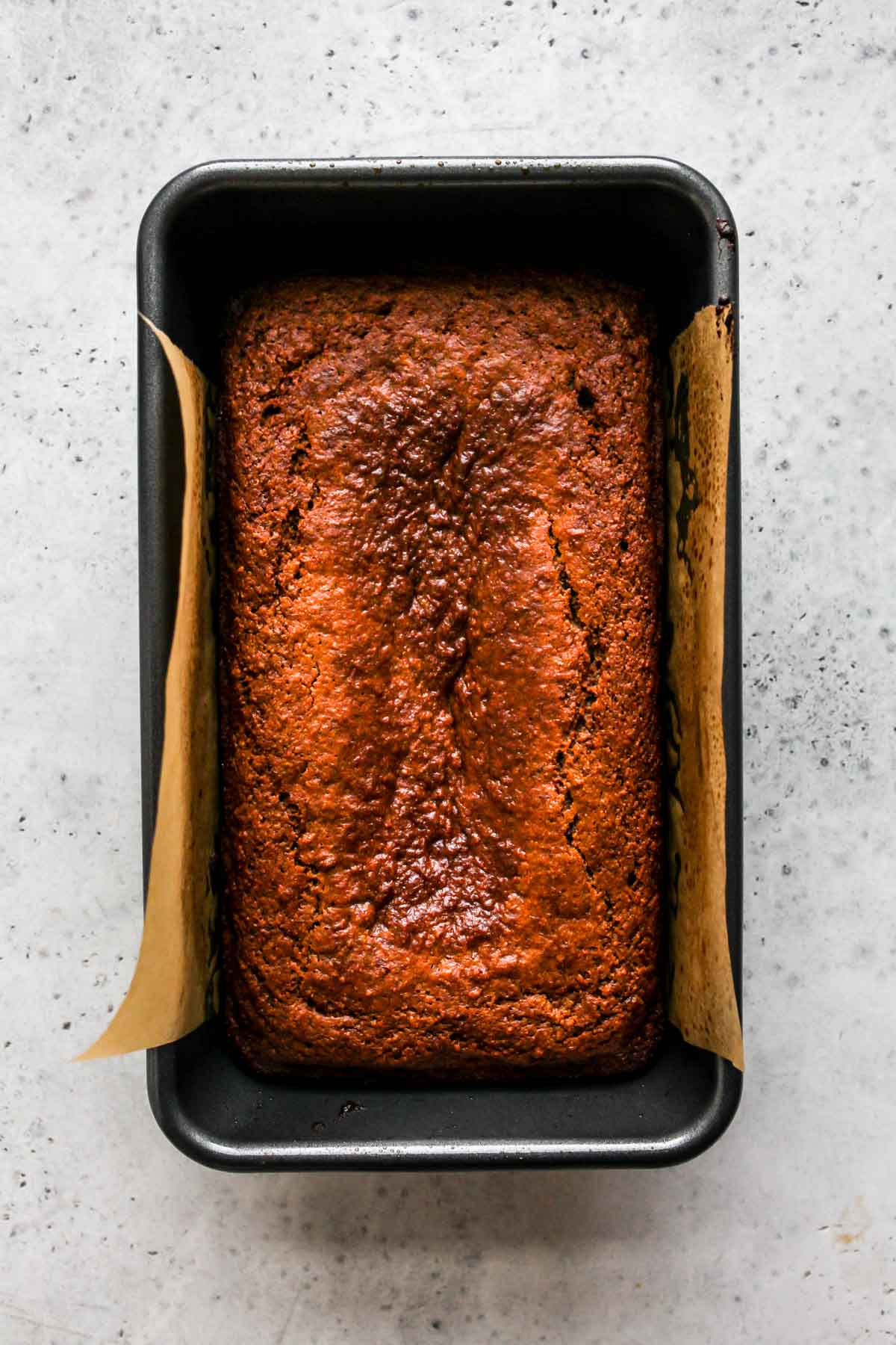 Gingerbread Banana Bread in a loaf pan after being baked.