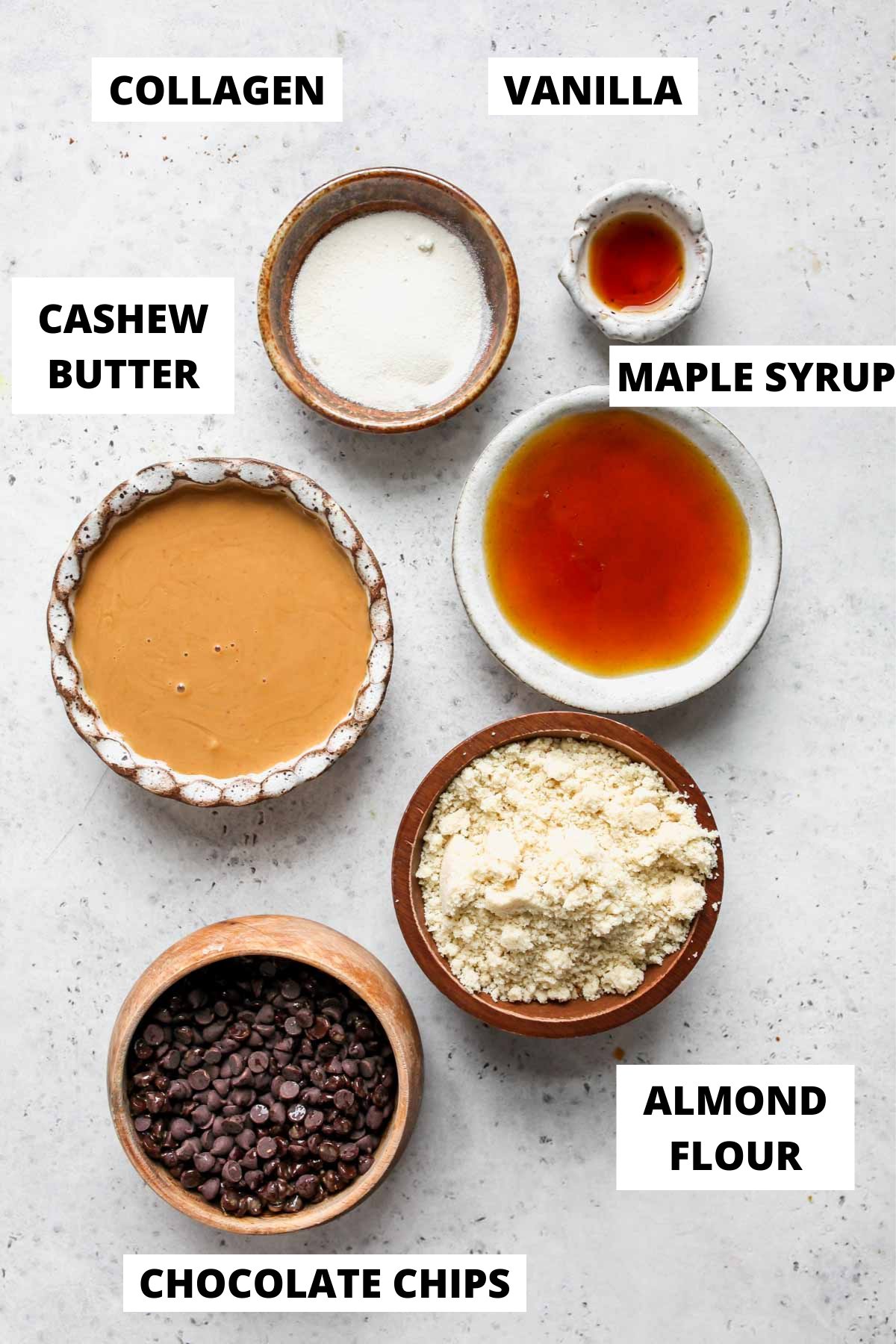 Recipe ingredients in separate bowls with white labels