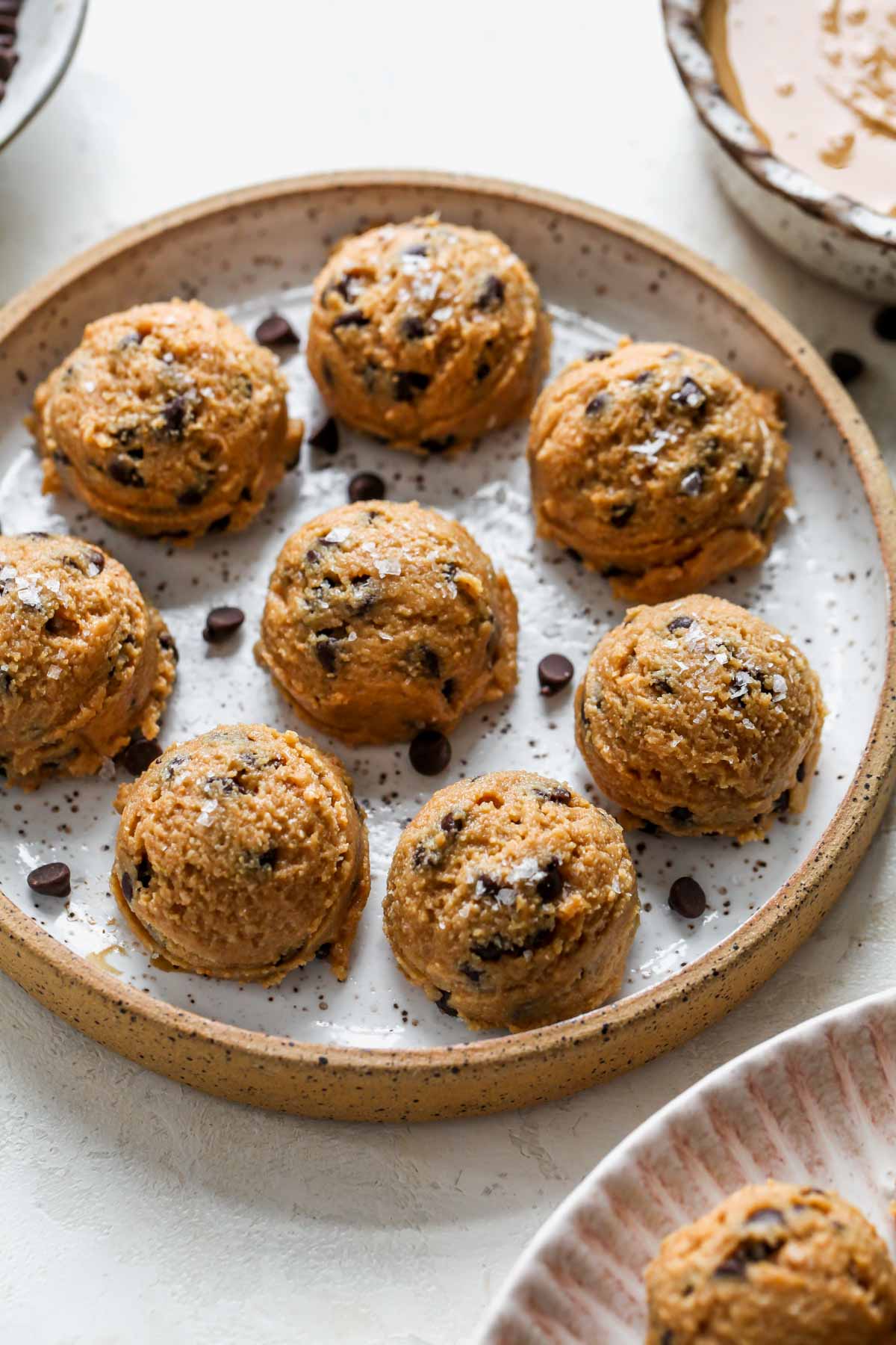 Cookie dough protein balls arranged on a plate