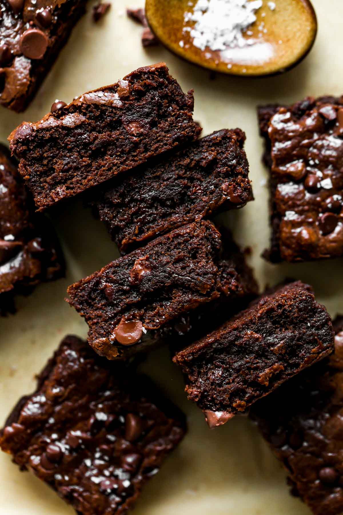 Brownies arranged on a piece of parchment paper