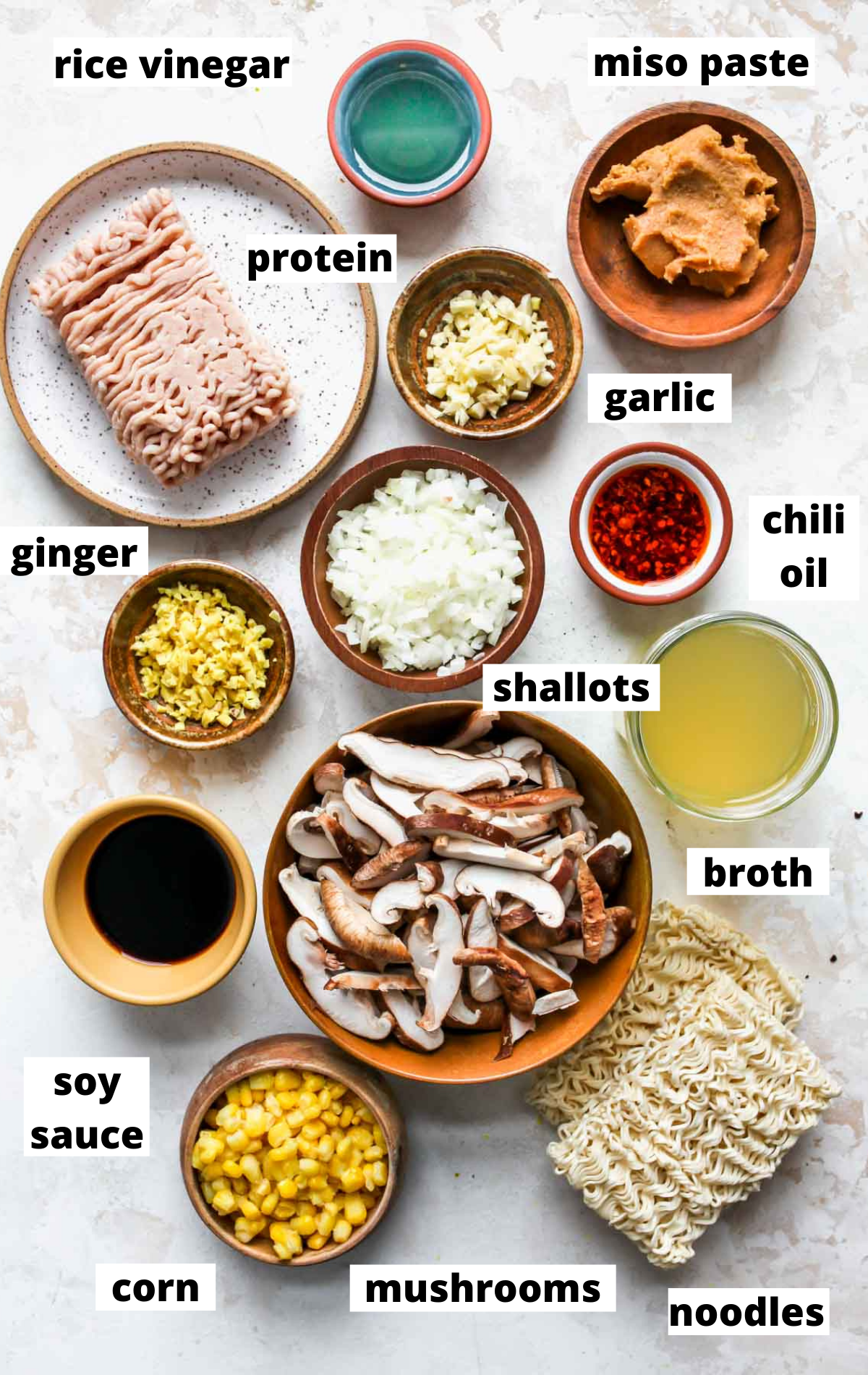 Recipe ingredients in separate bowls with title labels.
