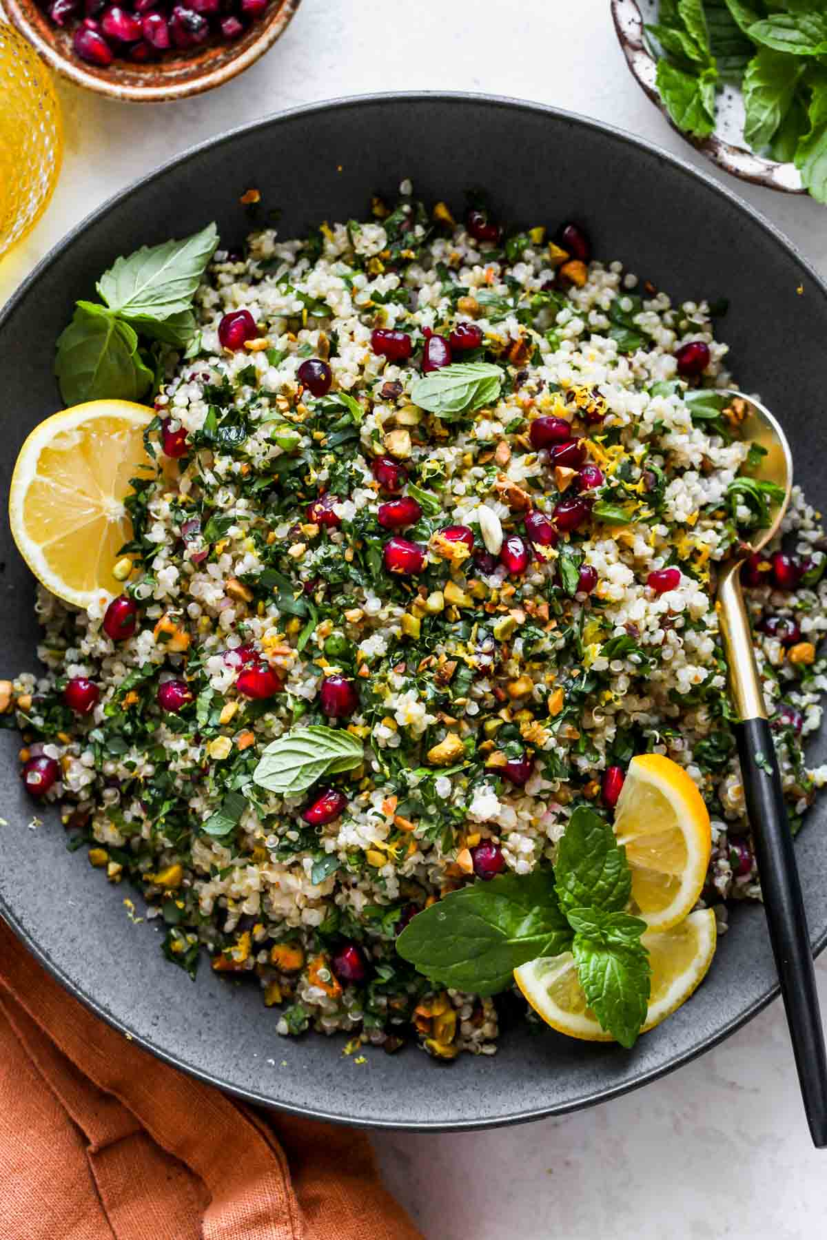 Quinoa Tabbouleh Salad styled in a black serving bowl