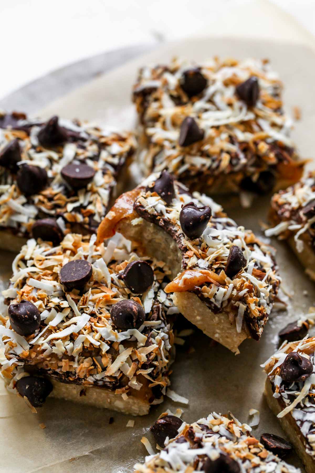 No Bake peanut butter bars with a bite taken out to show inside