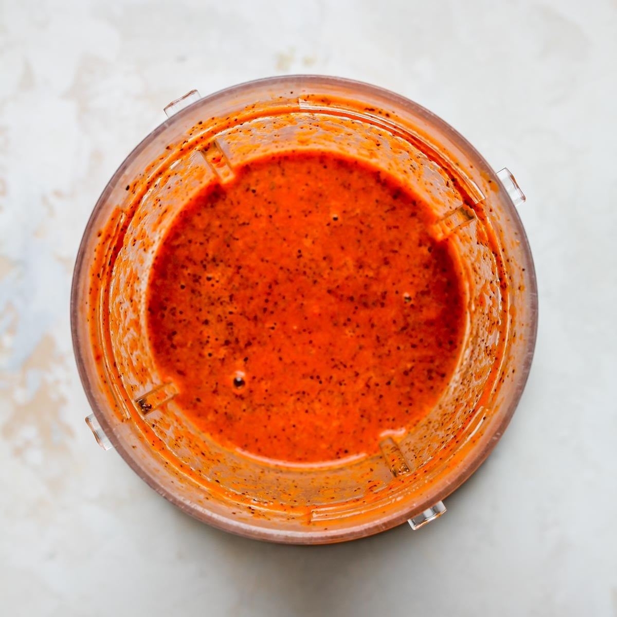 Homemade enchilada sauce being blended in a Nutribullet