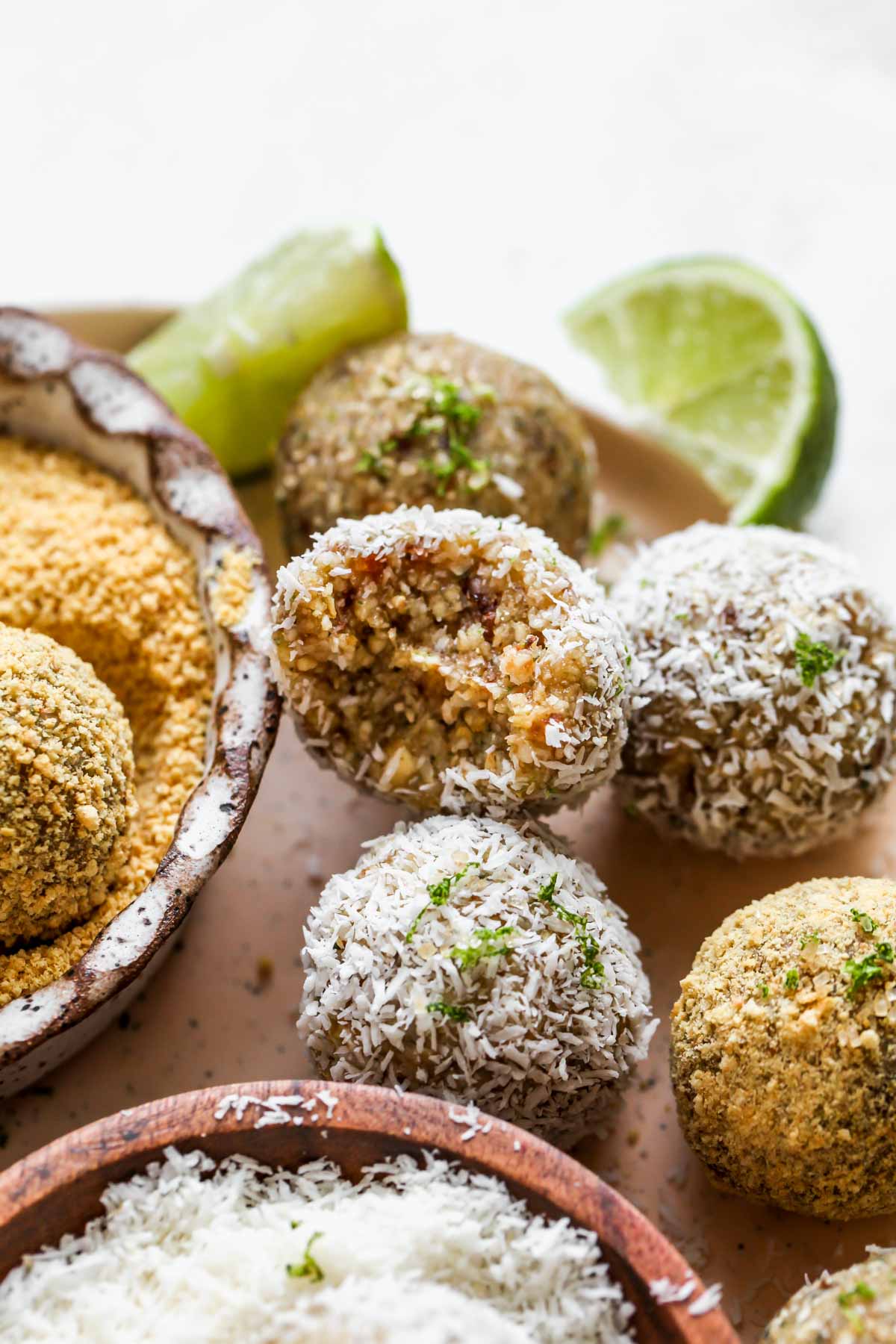 Key lime energy balls with a bite taken out to show center